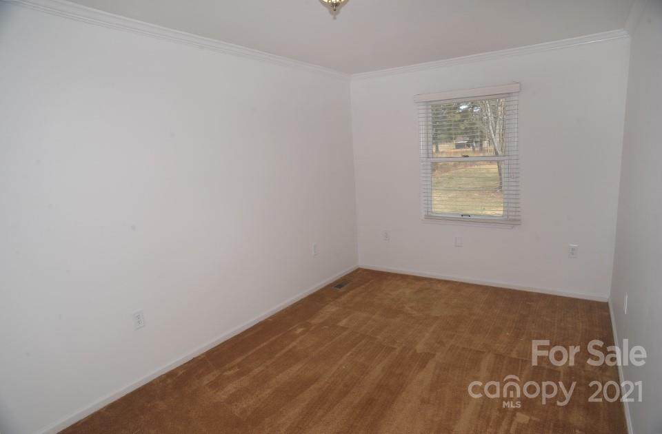 1220 Brison Road Woodleaf, NC 27054 - Photo 21 of 28 an empty room with a window