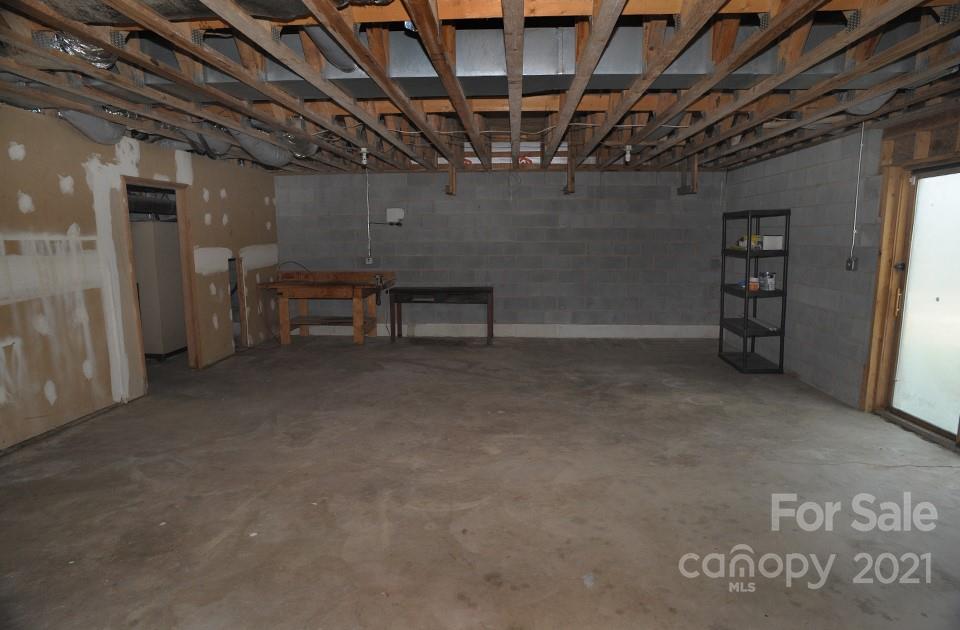 1220 Brison Road Woodleaf, NC 27054 - Photo 24 of 28 a view of a room with wooden walls