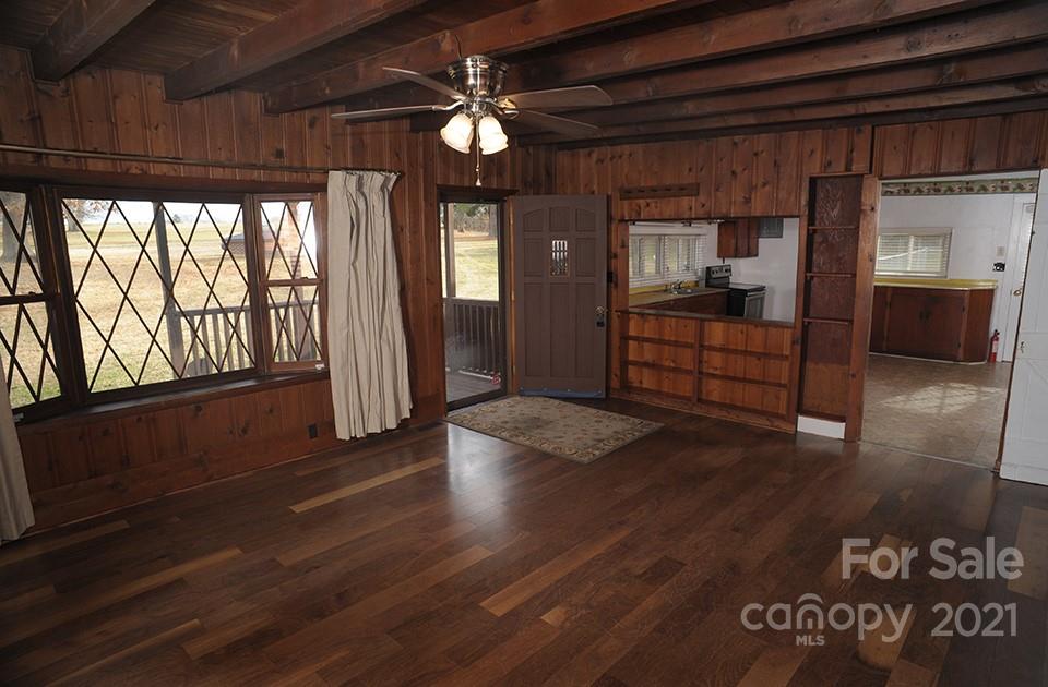 1220 Brison Road Woodleaf, NC 27054 - Photo 8 of 28 a view of a livingroom with wooden floor