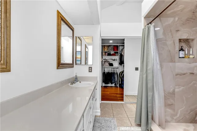 a en suite bathroom with a bathtub and a shower