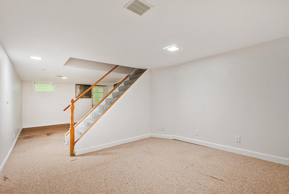 1016 Winsford Road Towson, MD 21204 - Photo 30 of 42 an empty room with stairs