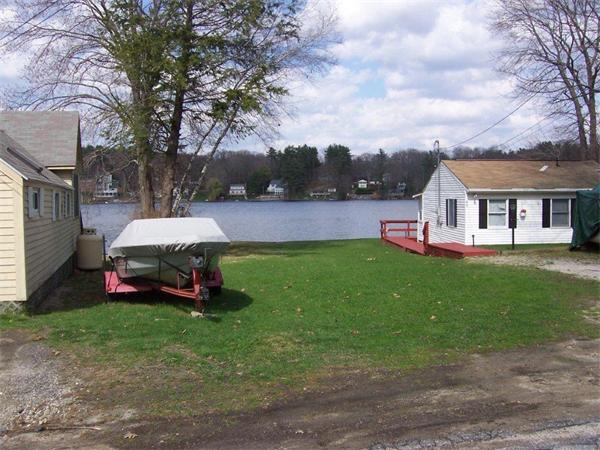 42 Ash Road Charlton, MA 01507 - Photo 8 of 8 a view of a house with a yard and sitting area