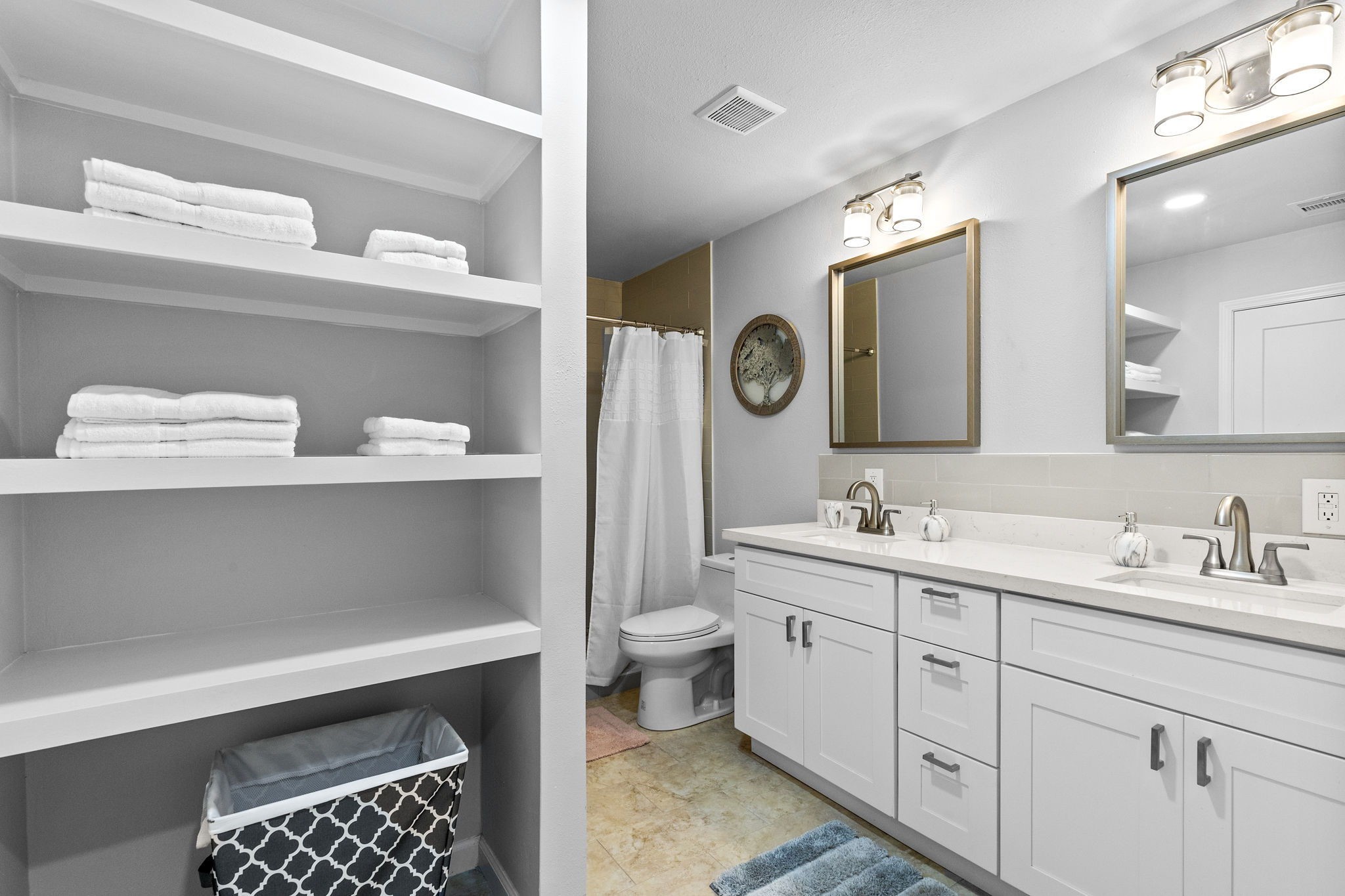 412 Waco Avenue League City, TX 77573 - Photo 13 of 28 a bathroom with a sink a toilet and a mirror
