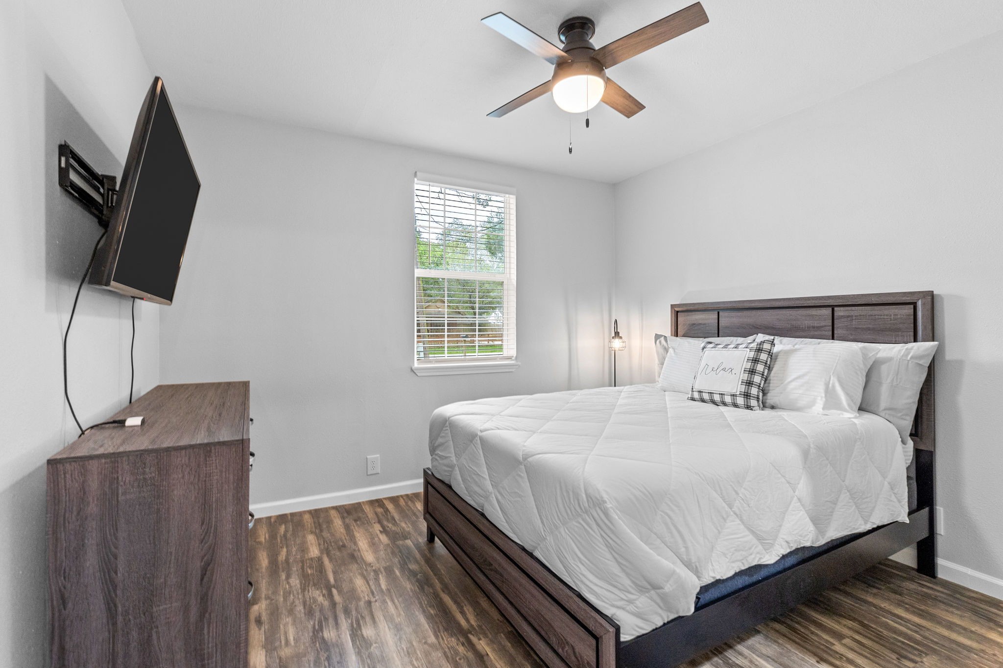 412 Waco Avenue League City, TX 77573 - Photo 16 of 28 a bedroom with a bed and a flat screen tv