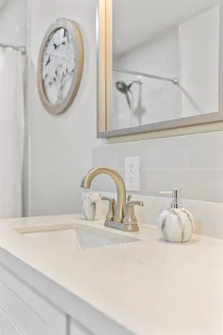 a close view of a sink with a vanity in it