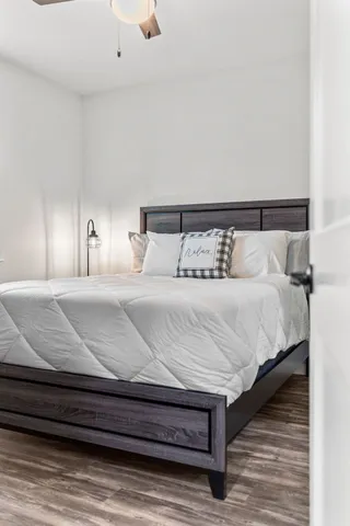 a kitchen with a stove and wooden cabinets