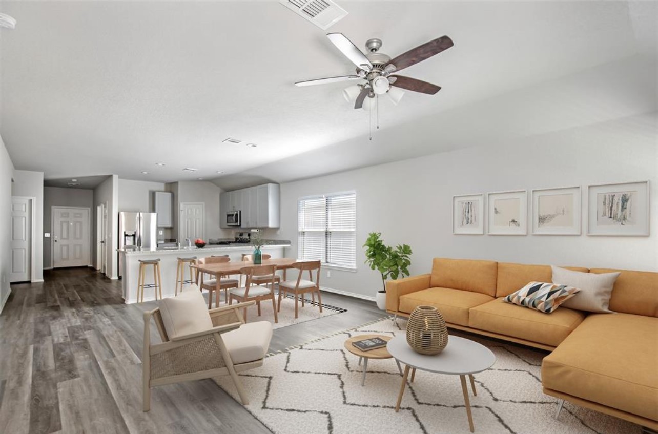 10031 Spring Creek Road Cleveland, TX 77327 - Photo 1 of 18 a living room with furniture kitchen view and a window