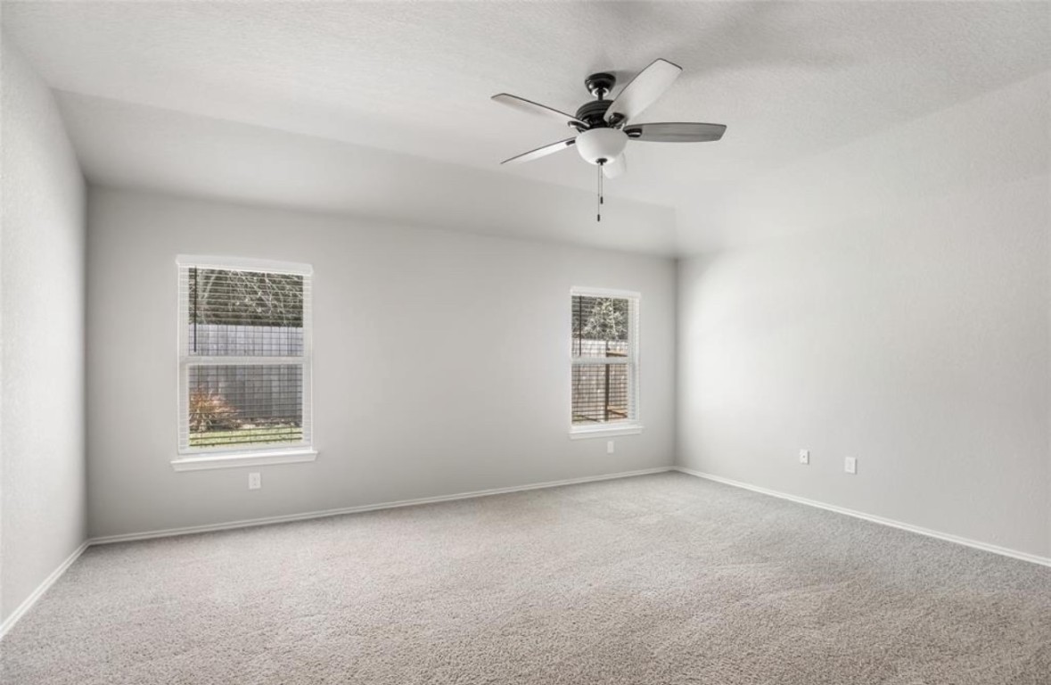10031 Spring Creek Road Cleveland, TX 77327 - Photo 13 of 18 a view of an empty room with a window