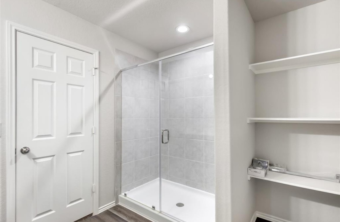 10031 Spring Creek Road Cleveland, TX 77327 - Photo 15 of 18 a bathroom with a shower