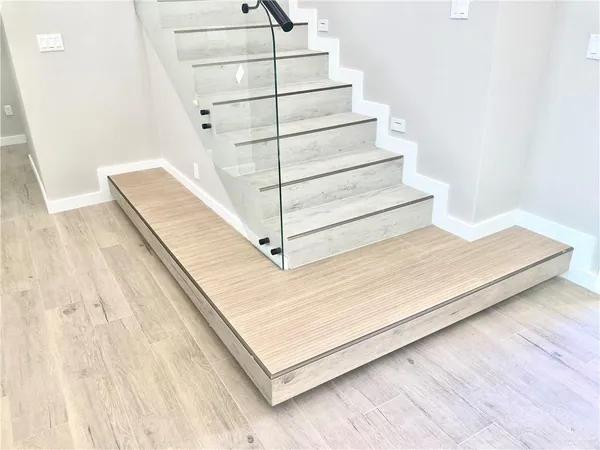 a view of staircase with white walls
