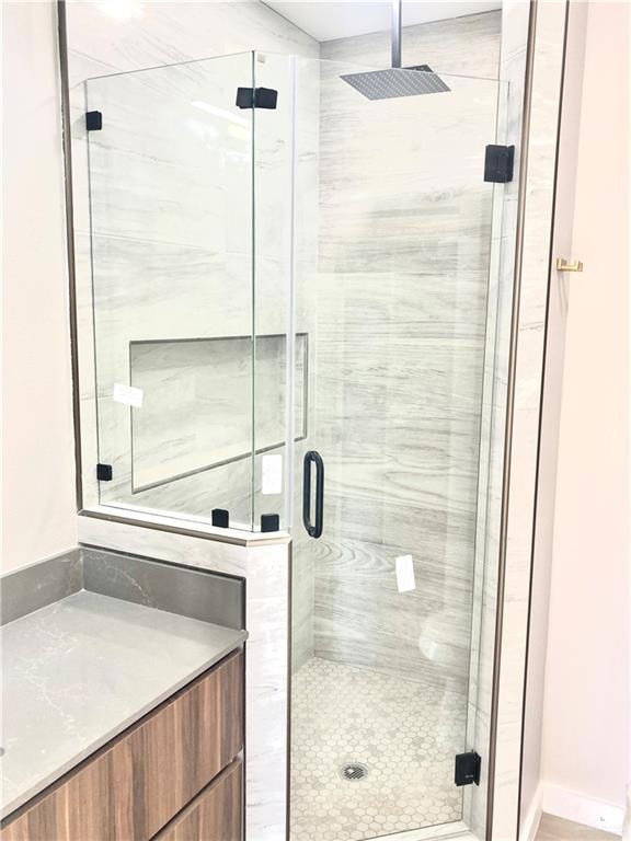2218 Corales Street Mission, TX 78573 - Photo 20 of 22 a bathroom with a shower and a sink
