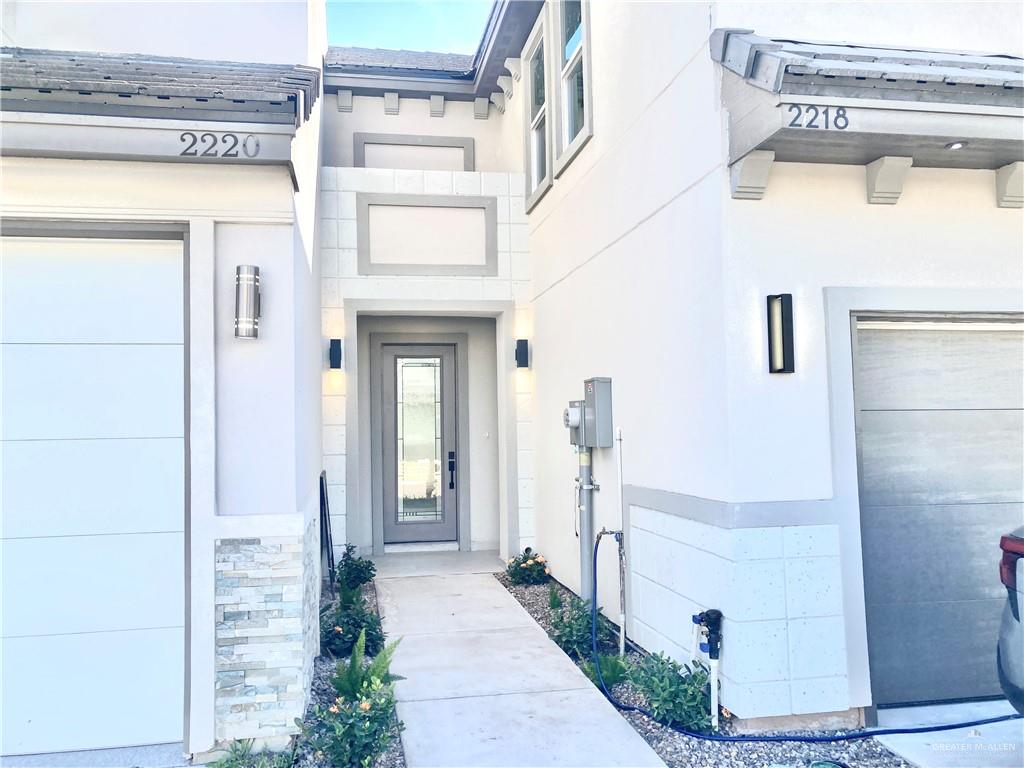 2218 Corales Street Mission, TX 78573 - Photo 2 of 22 a front view of a house with a glass door
