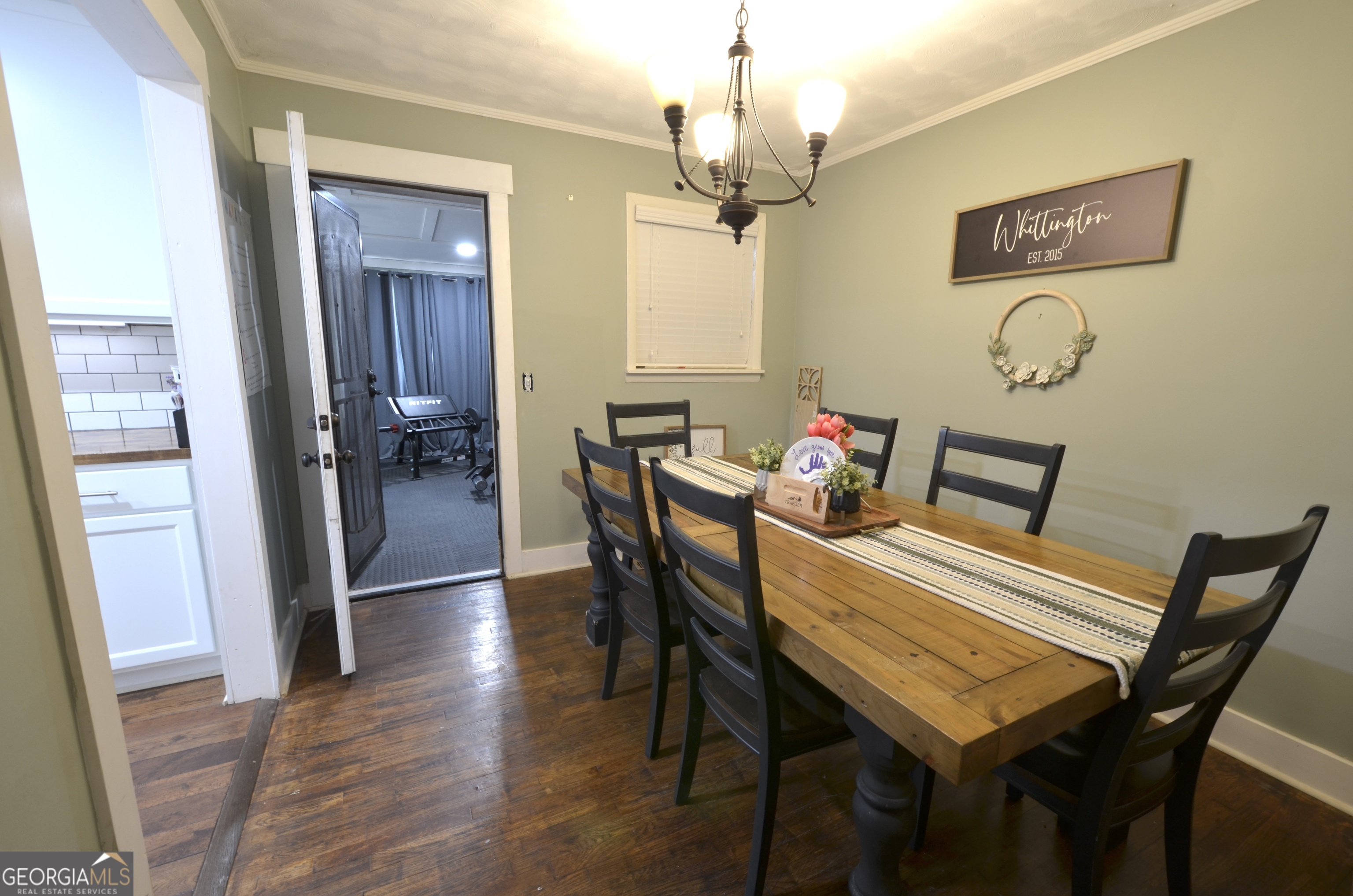 228 Legion Drive Eastman, GA 31023 - Photo 12 of 37 a view of a dining room with furniture and wooden floor