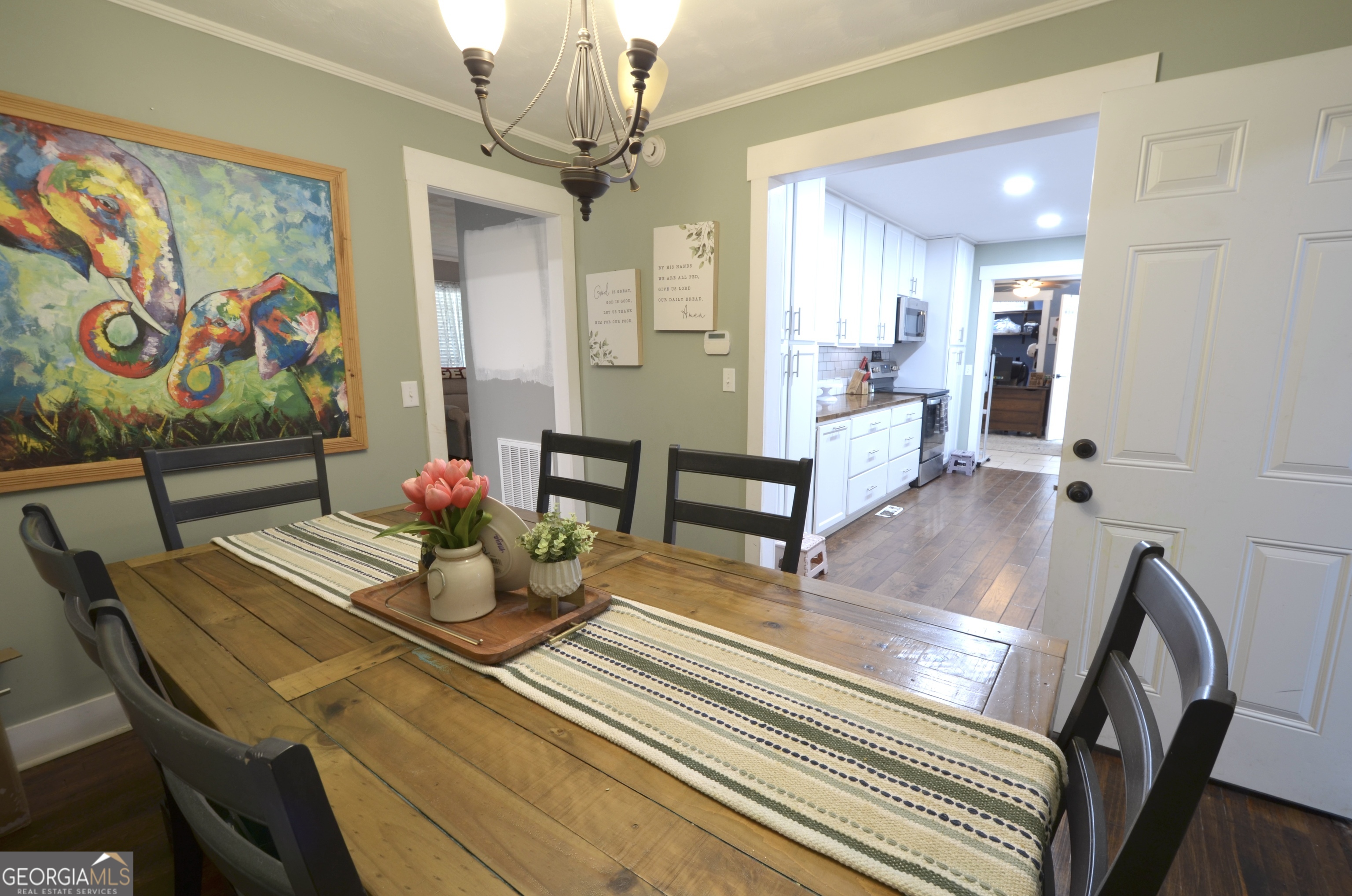 228 Legion Drive Eastman, GA 31023 - Photo 13 of 37 a view of a dining room with furniture and a chandelier