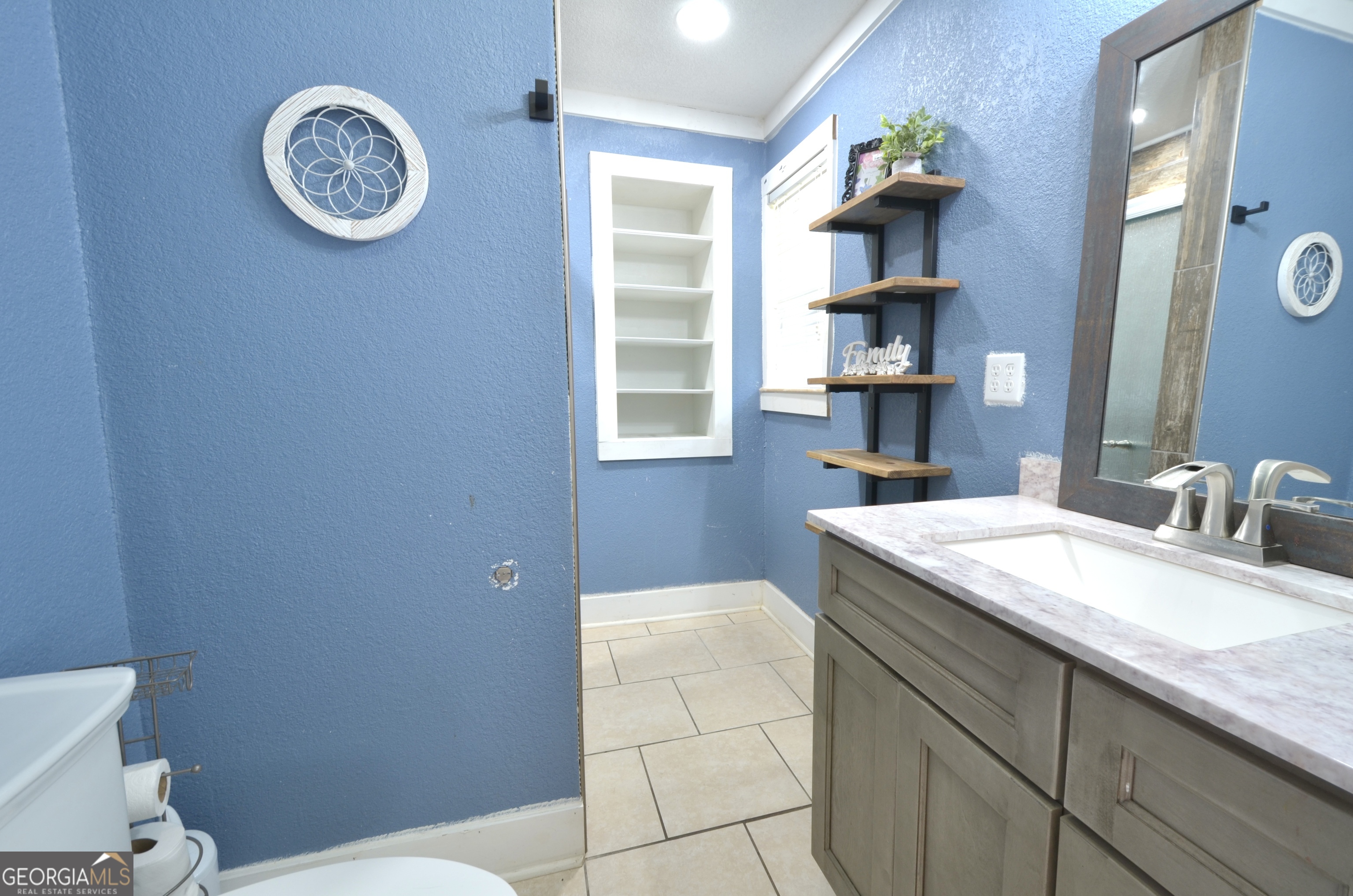 228 Legion Drive Eastman, GA 31023 - Photo 24 of 37 a bathroom with a sink and a mirror