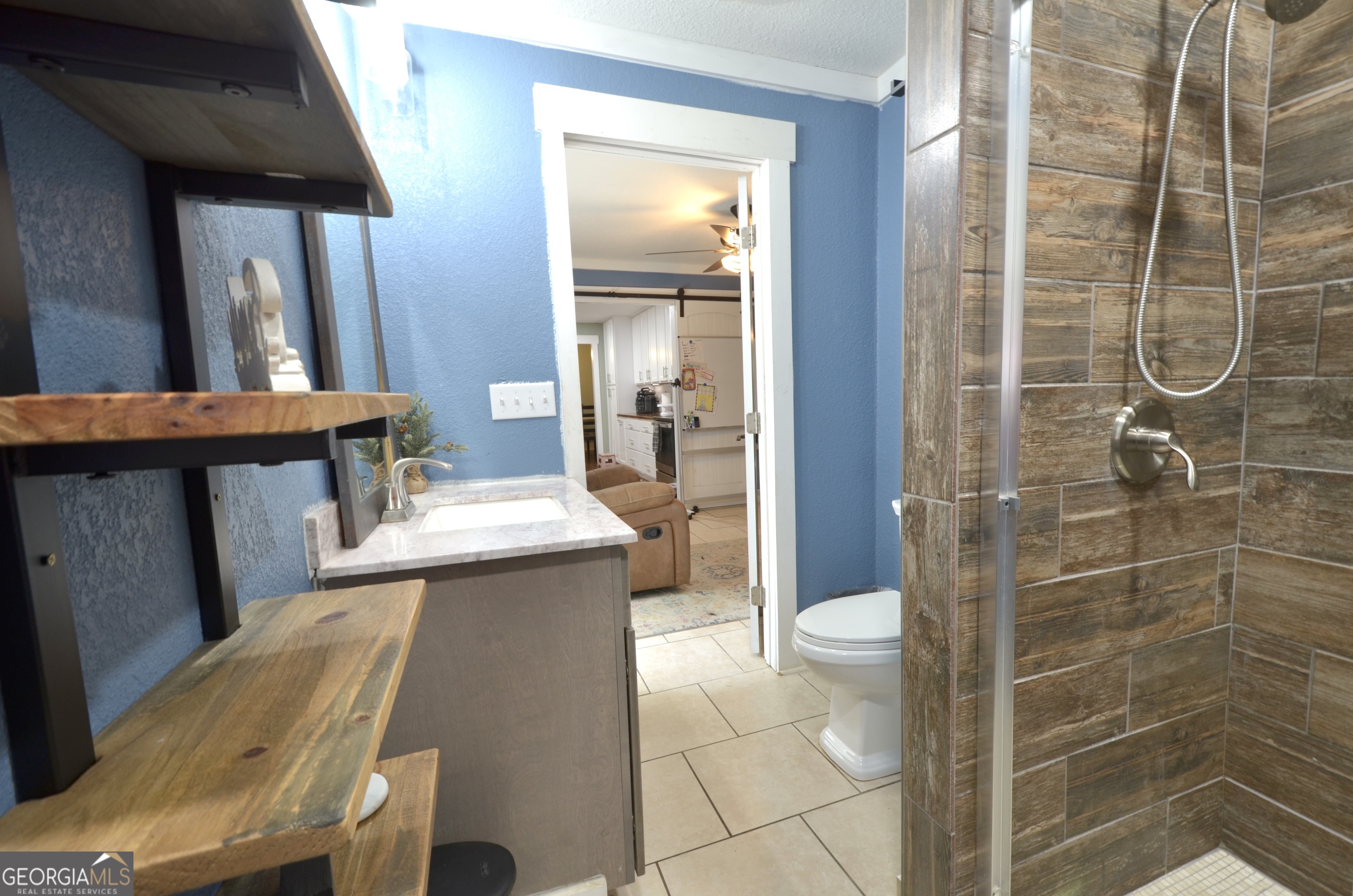 228 Legion Drive Eastman, GA 31023 - Photo 25 of 37 a bathroom with a sink toilet and shower
