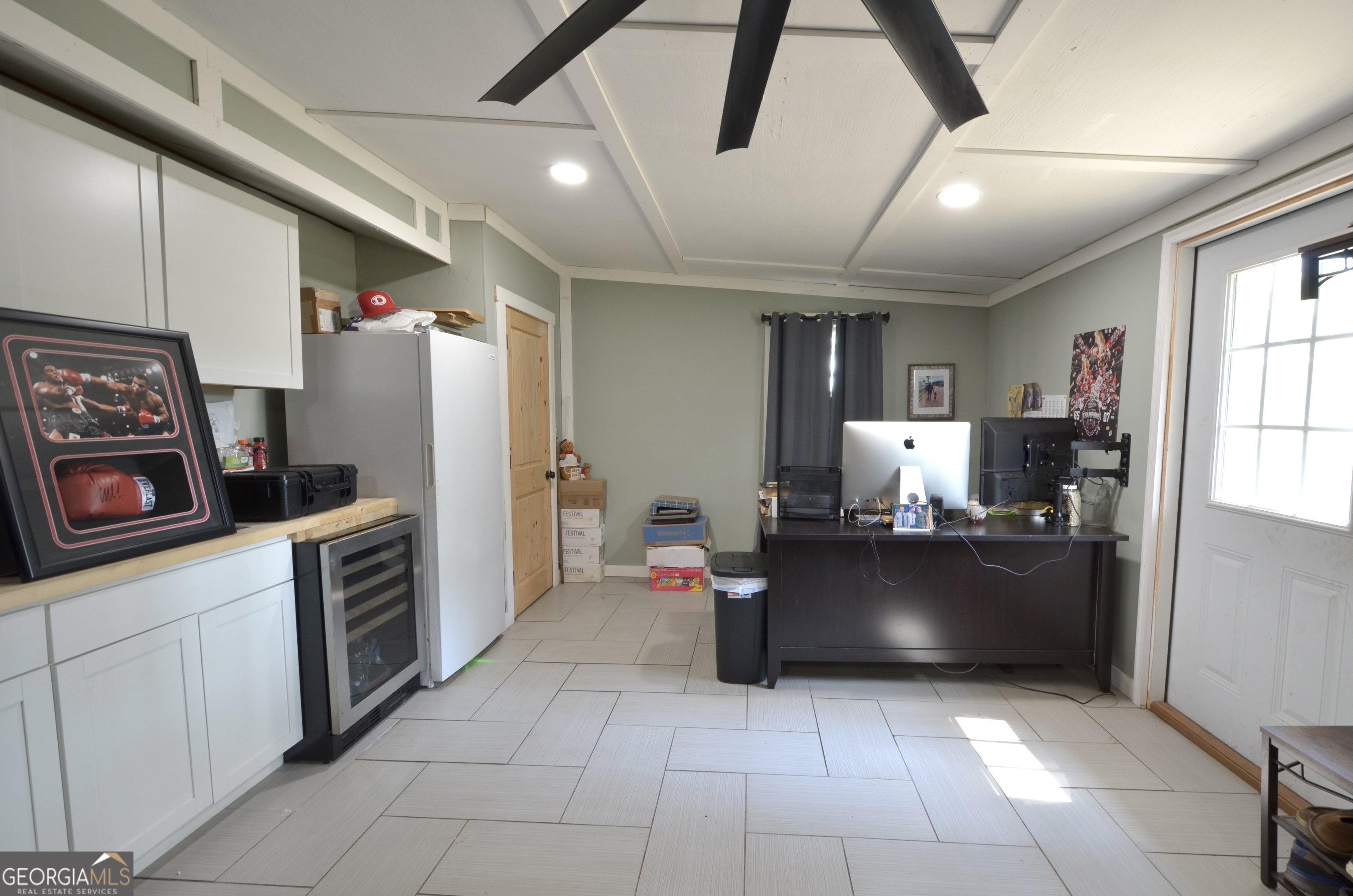 228 Legion Drive Eastman, GA 31023 - Photo 29 of 37 a kitchen with refrigerator and cabinets