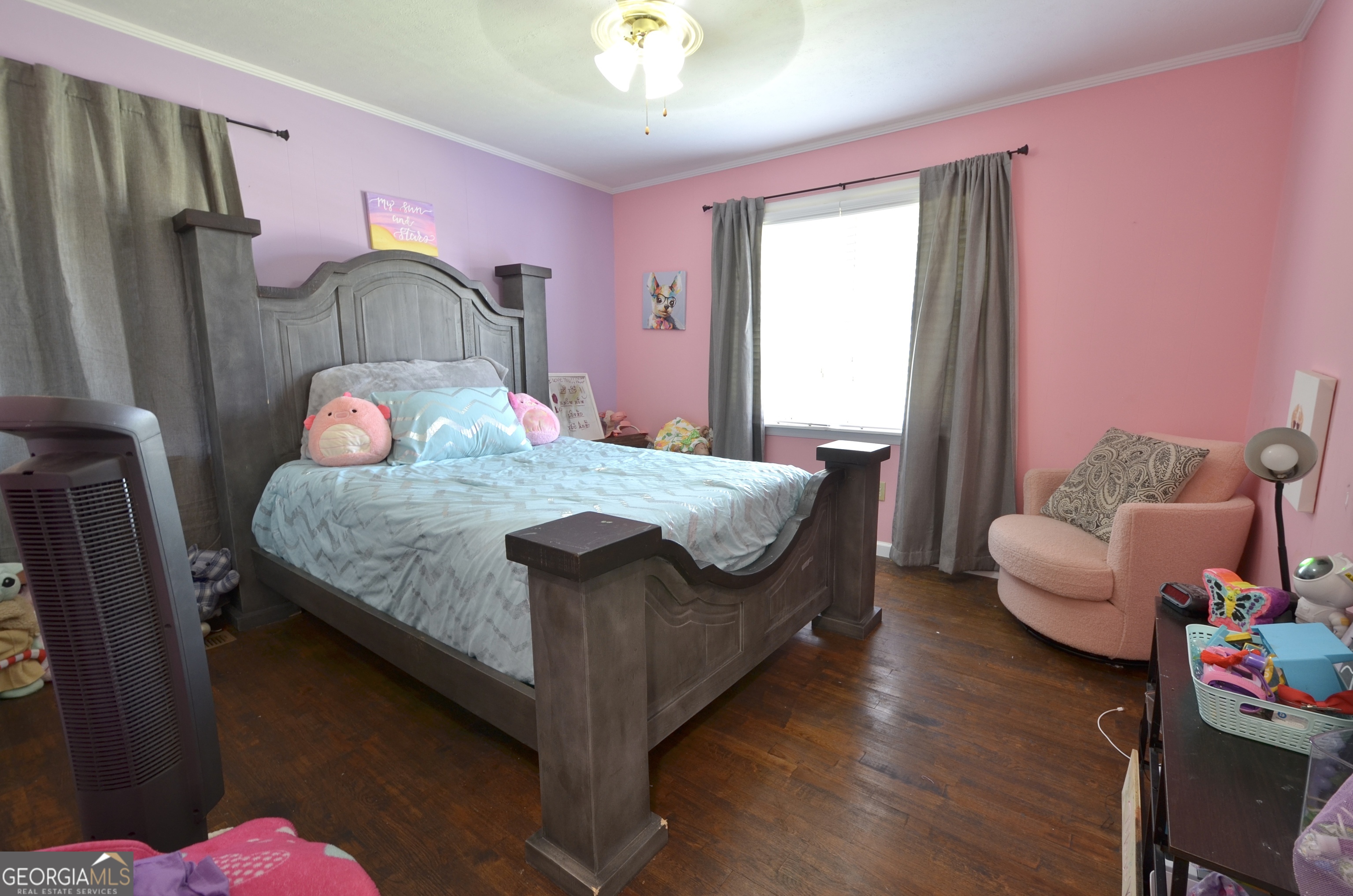 228 Legion Drive Eastman, GA 31023 - Photo 31 of 37 a bedroom with a bed and wooden floor