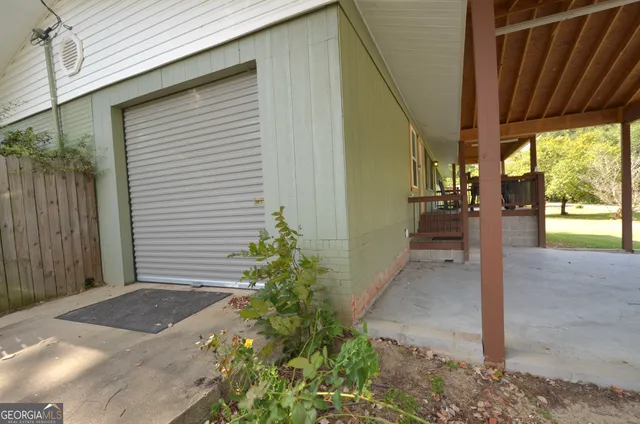 a backyard of a house with outdoor seating