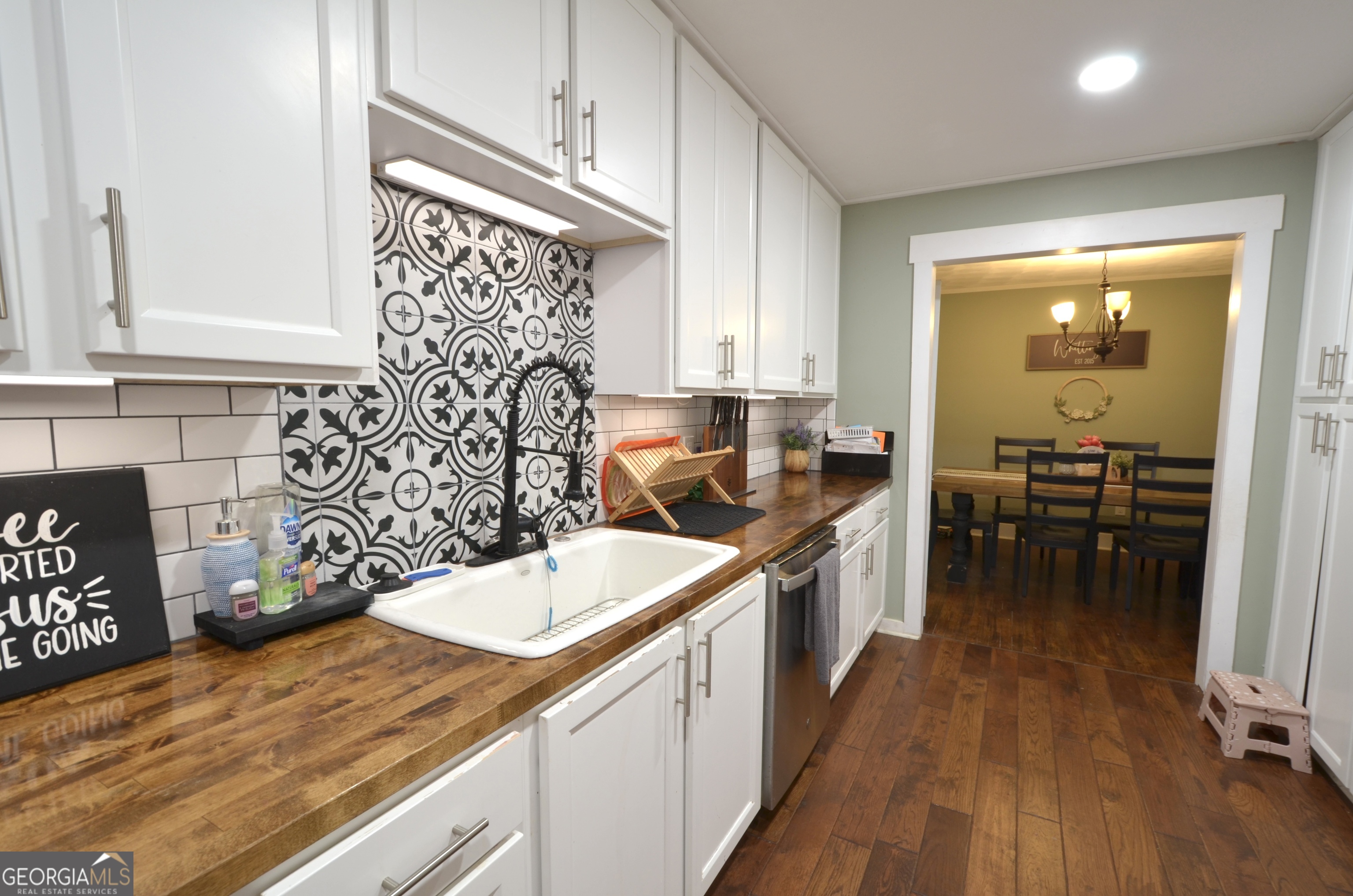 228 Legion Drive Eastman, GA 31023 - Photo 10 of 37 a kitchen with a sink and cabinets