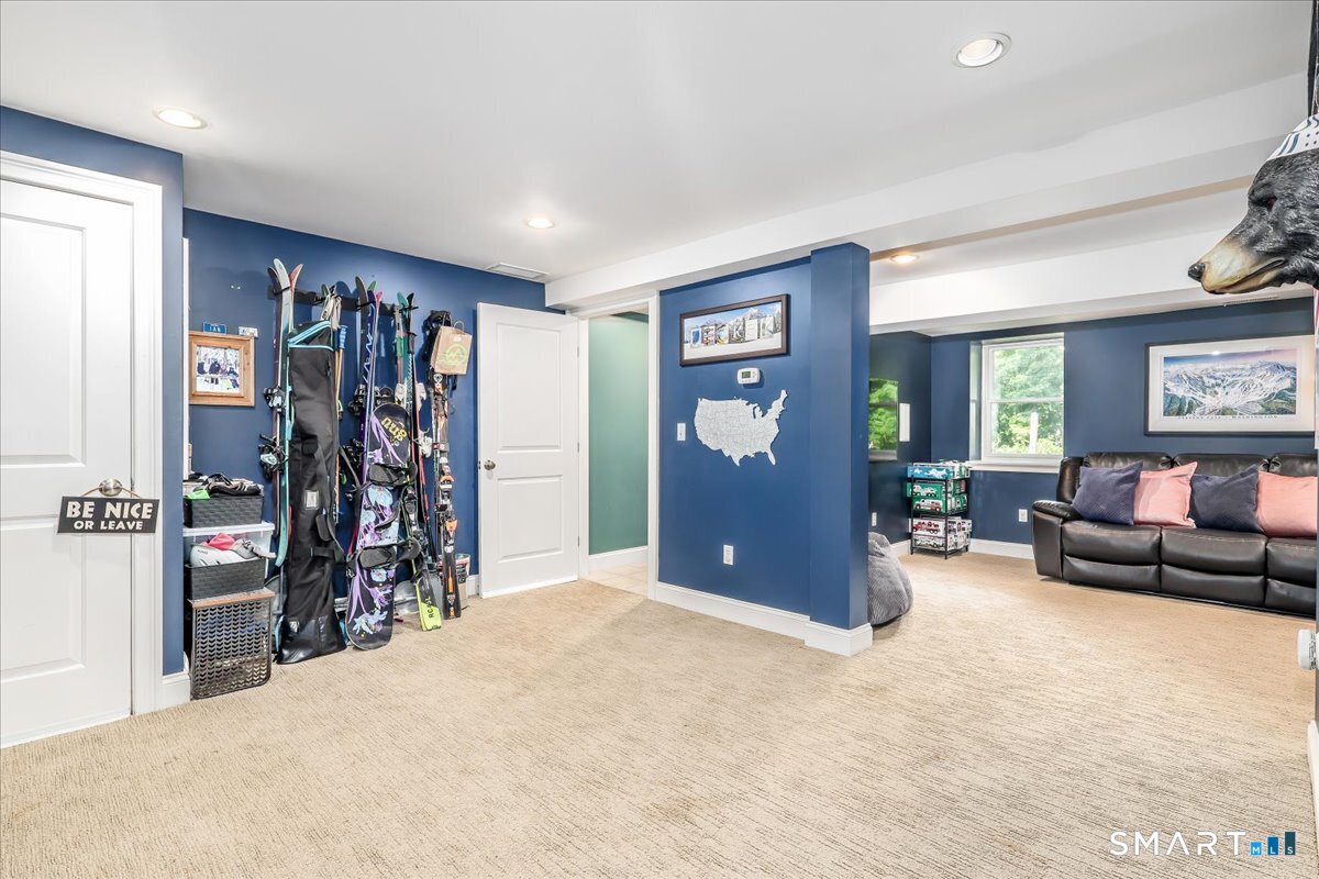 31 Aspen Mill Road Ridgefield, CT 06877 - Photo 25 of 38 Lower Level Rec Room is open and bright