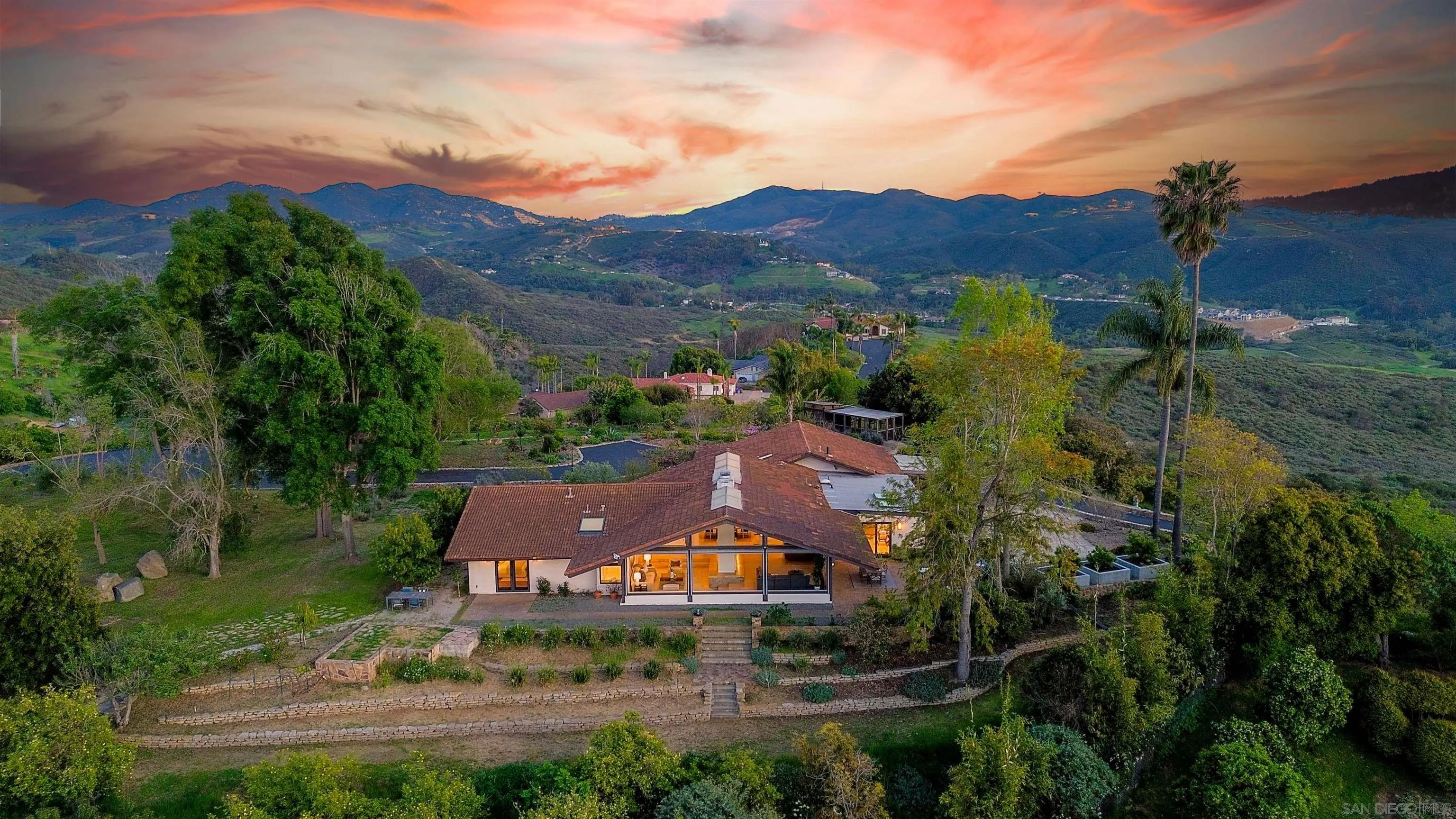 an aerial view of a house with a garden