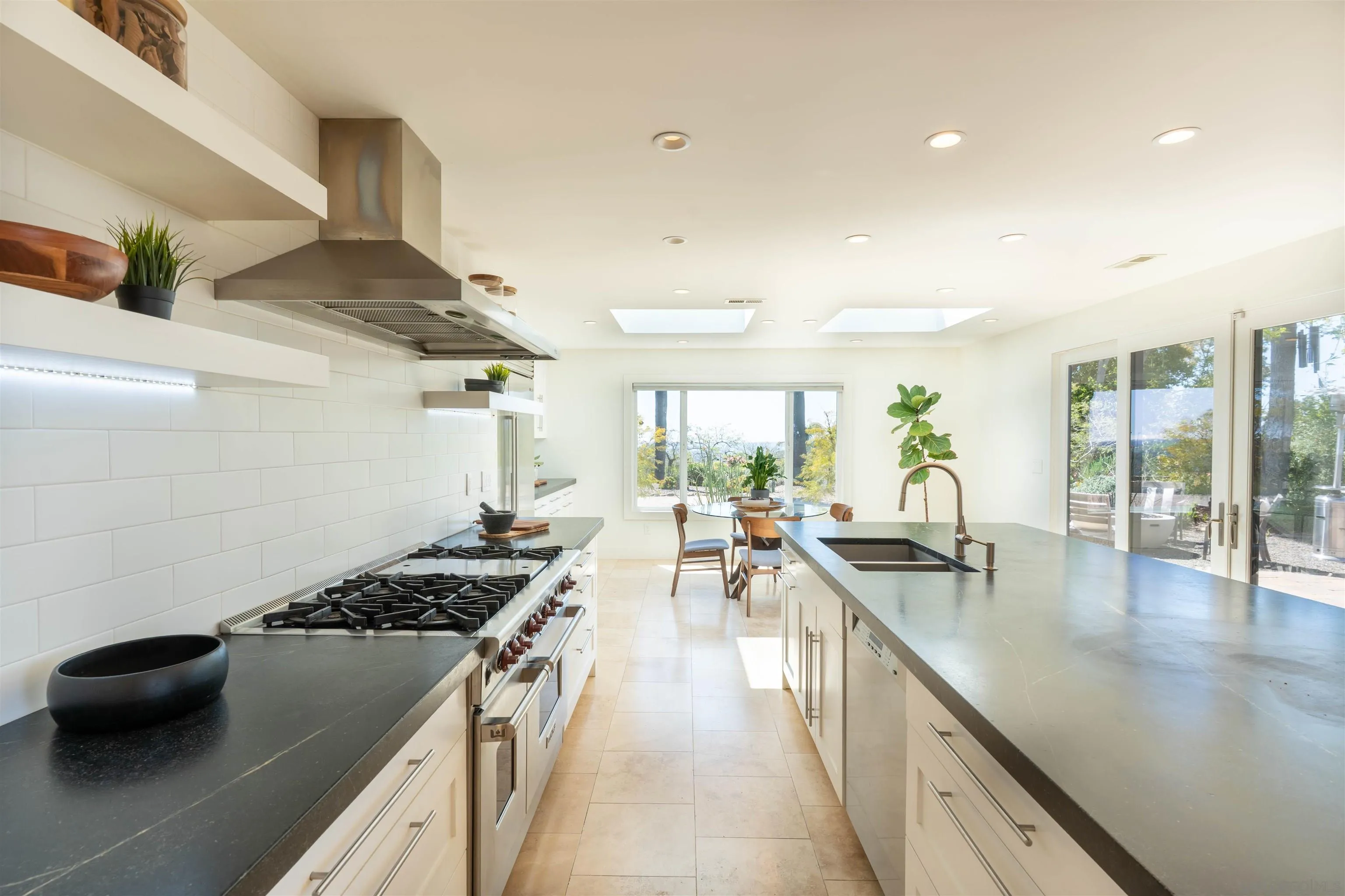 30410 Calle La Reina Bonsall, CA 92003 - Photo 11 of 54 a kitchen with sink stove and cabinets