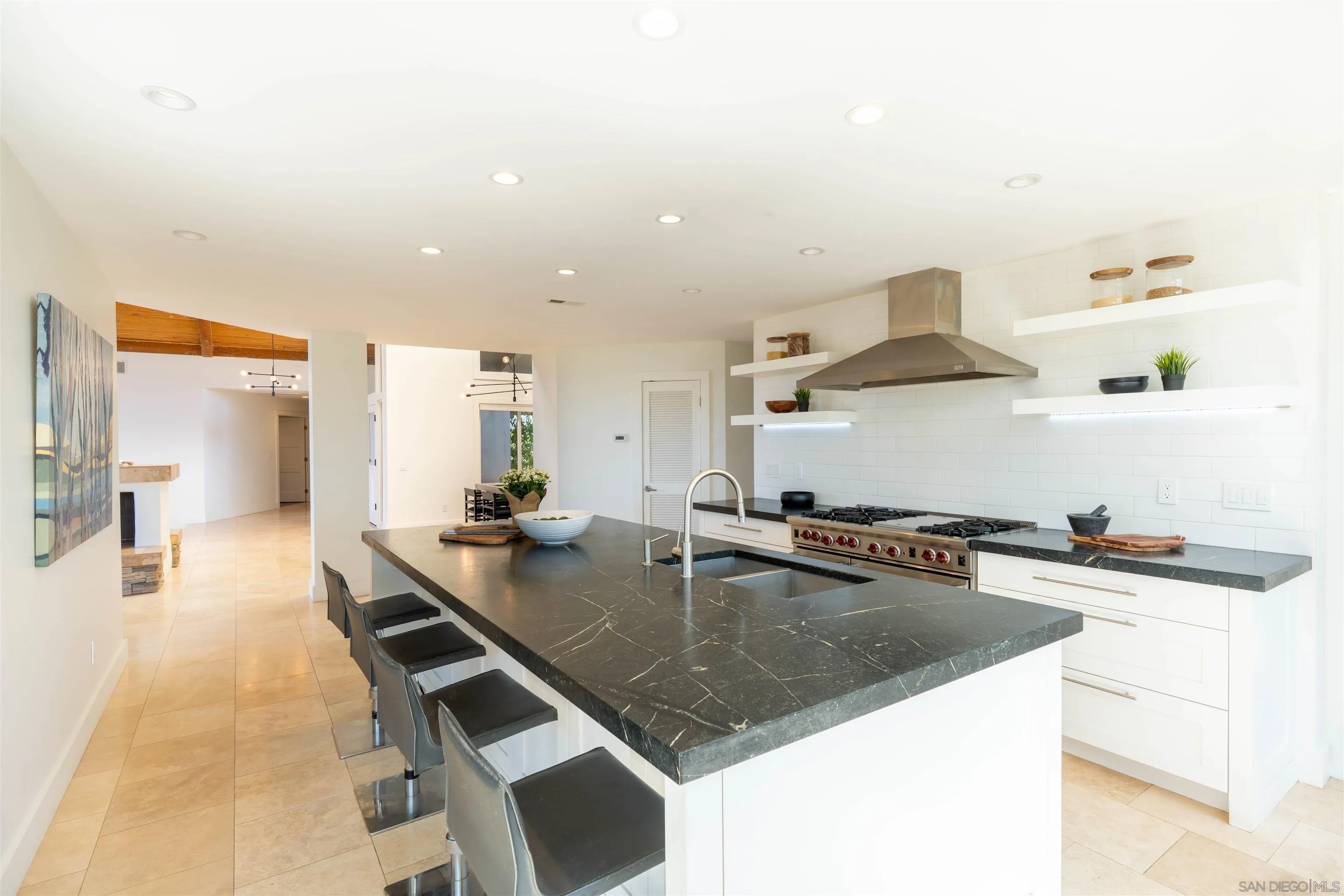 30410 Calle La Reina Bonsall, CA 92003 - Photo 12 of 54 a kitchen with a stove a sink and a refrigerator