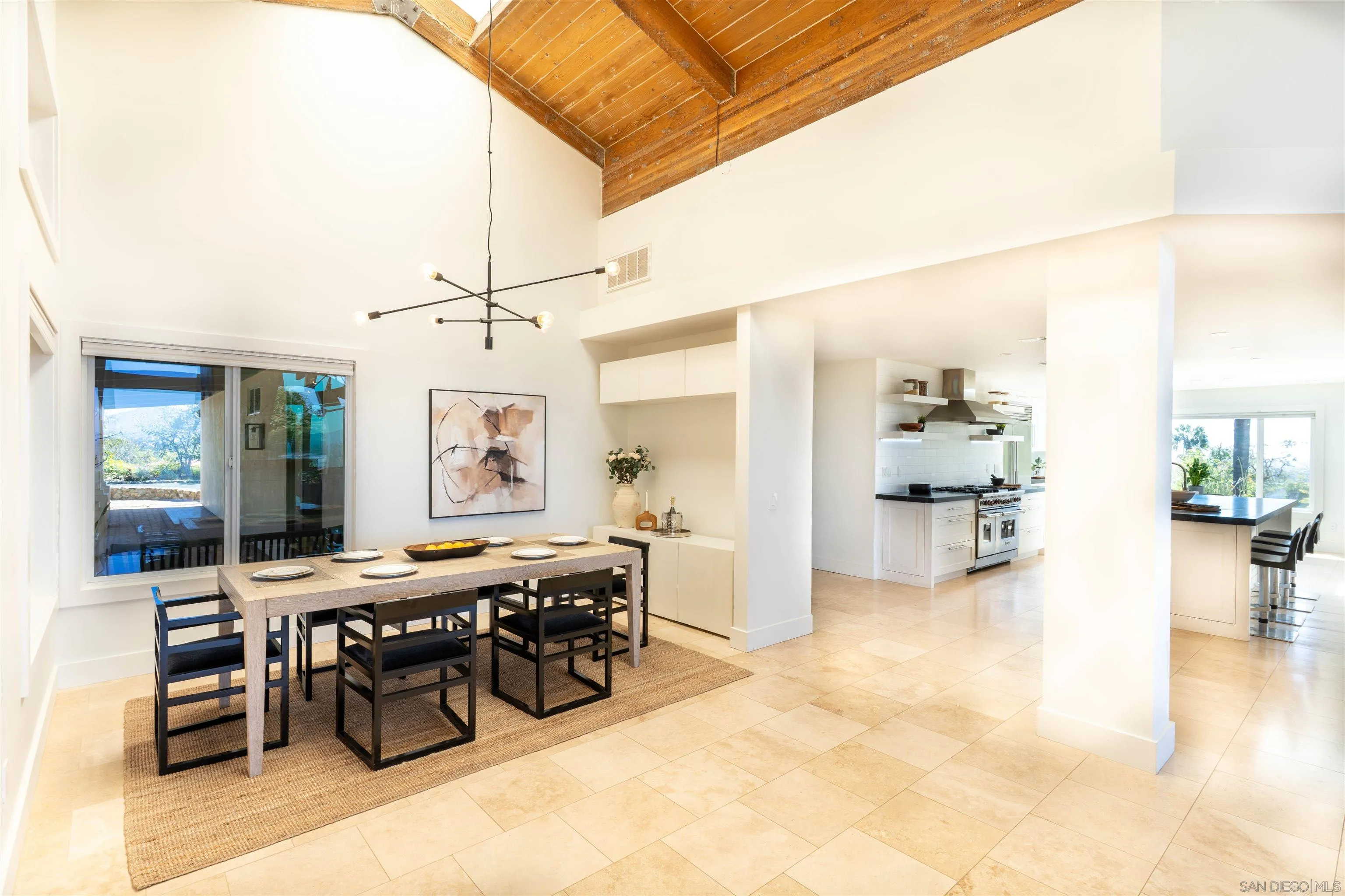 30410 Calle La Reina Bonsall, CA 92003 - Photo 14 of 54 a room with lots of furniture and a chandelier