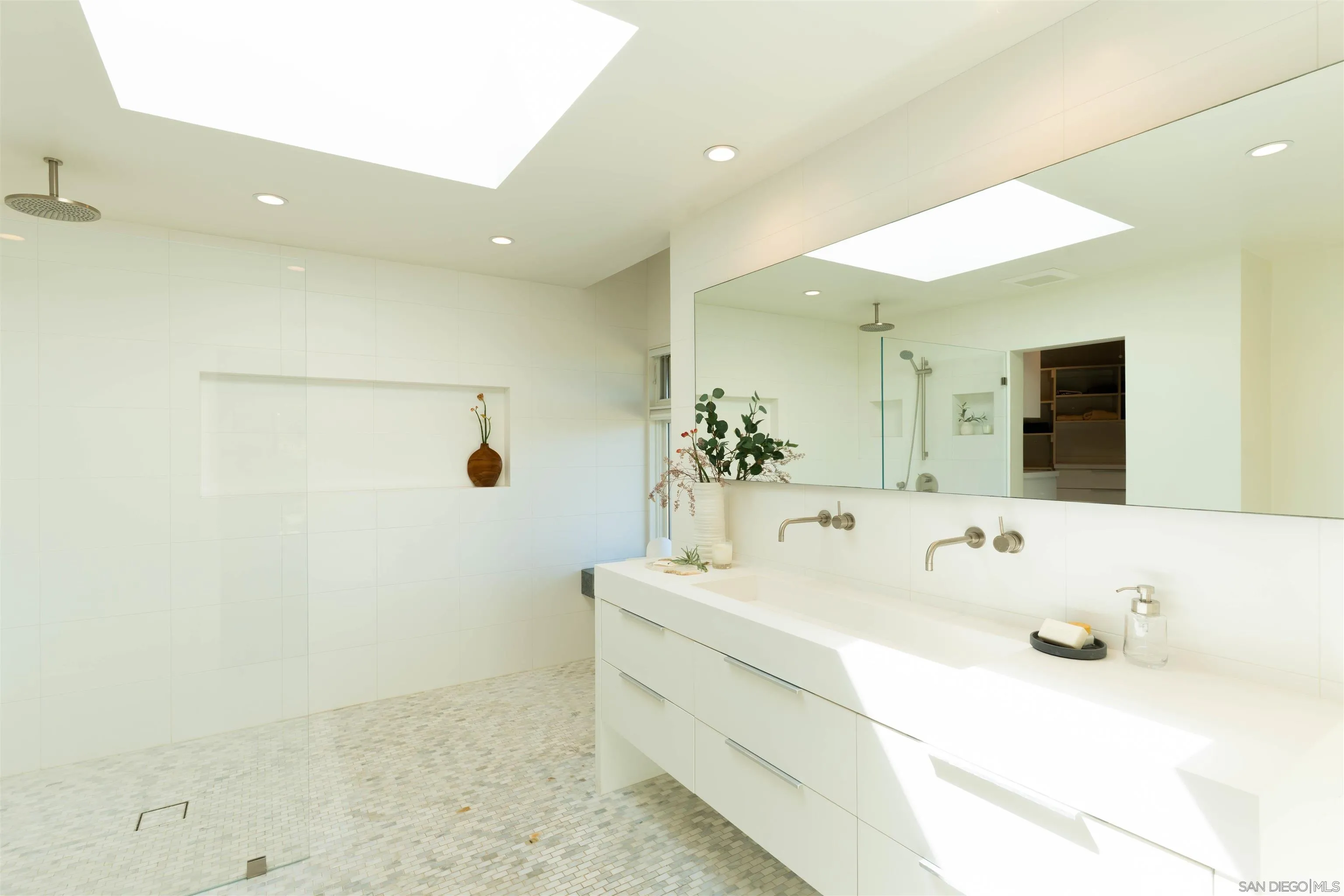 30410 Calle La Reina Bonsall, CA 92003 - Photo 18 of 54 a bathroom with a sink and a mirror