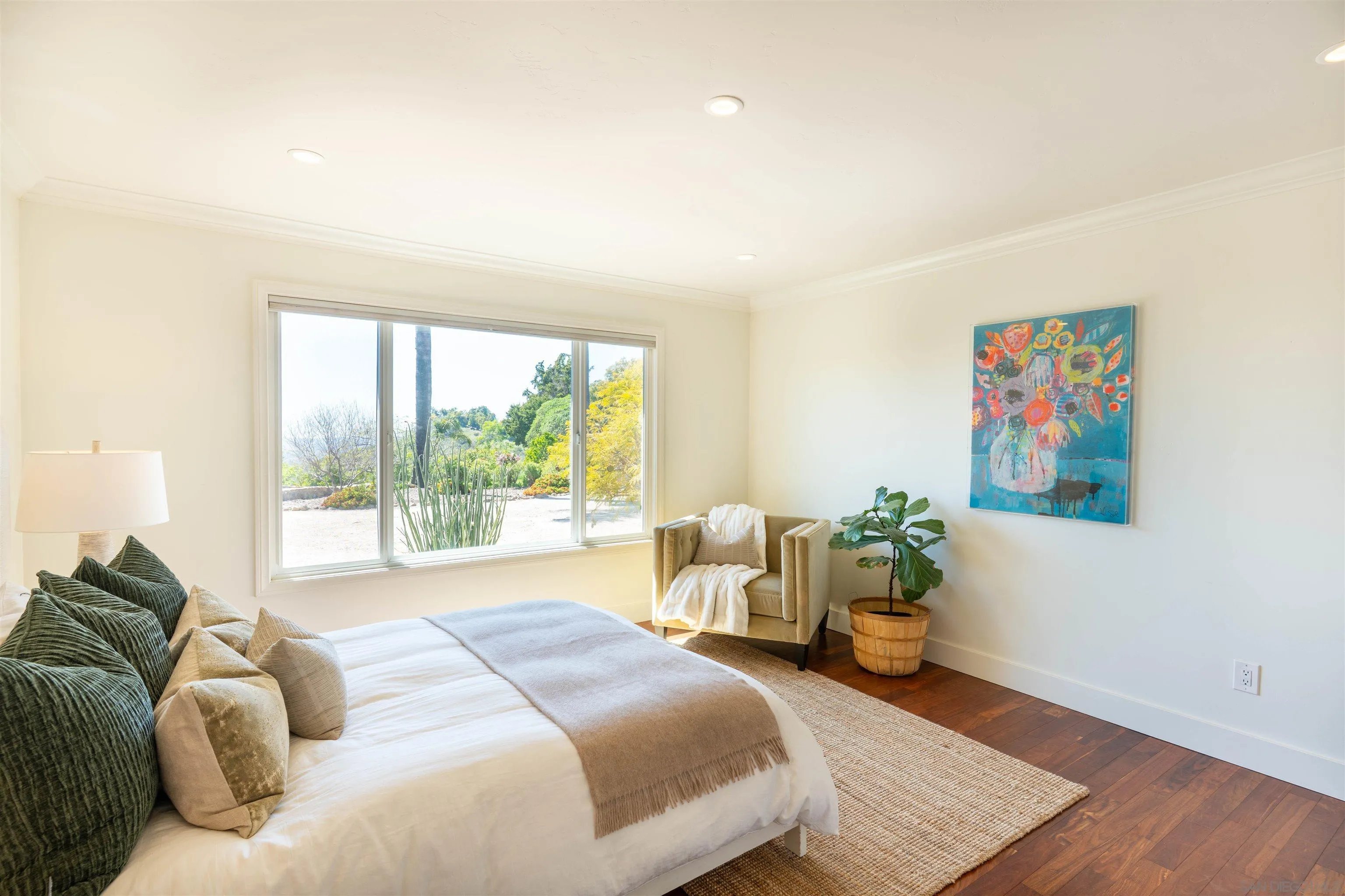 30410 Calle La Reina Bonsall, CA 92003 - Photo 21 of 54 a spacious bedroom with a bed and a large window