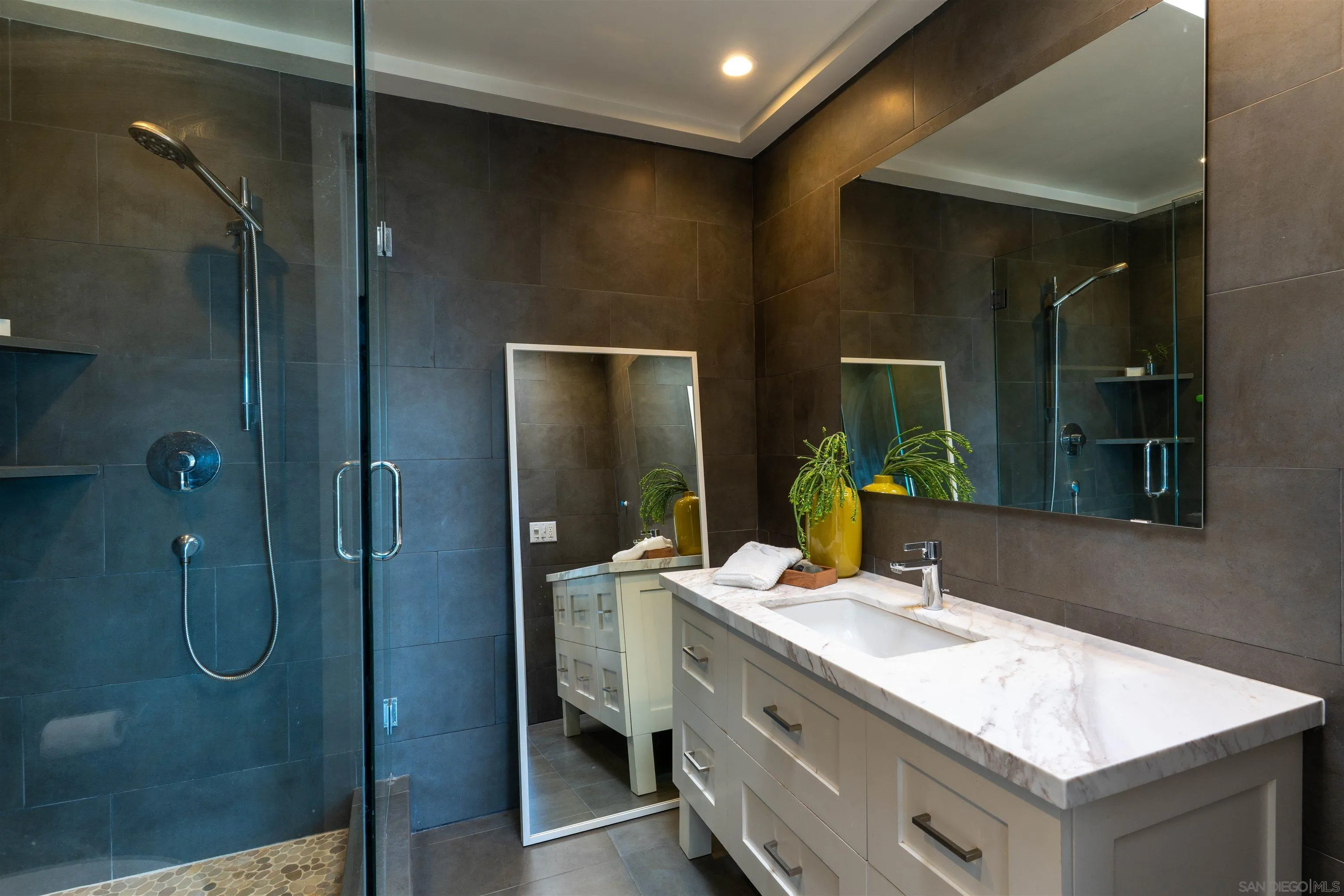 30410 Calle La Reina Bonsall, CA 92003 - Photo 24 of 54 a bathroom with a granite countertop sink shower and mirror