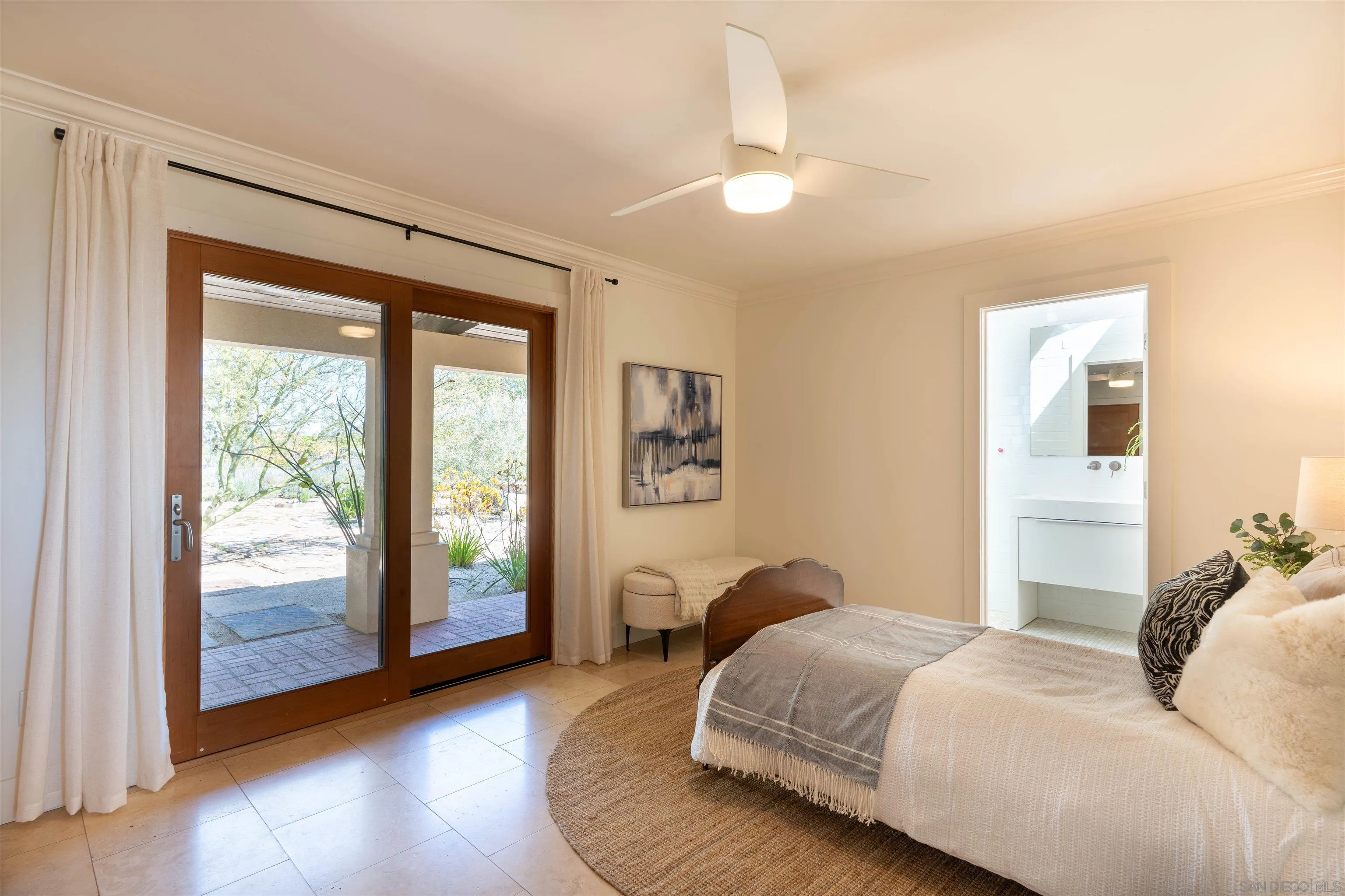 30410 Calle La Reina Bonsall, CA 92003 - Photo 25 of 54 a bedroom with a large bed and a window