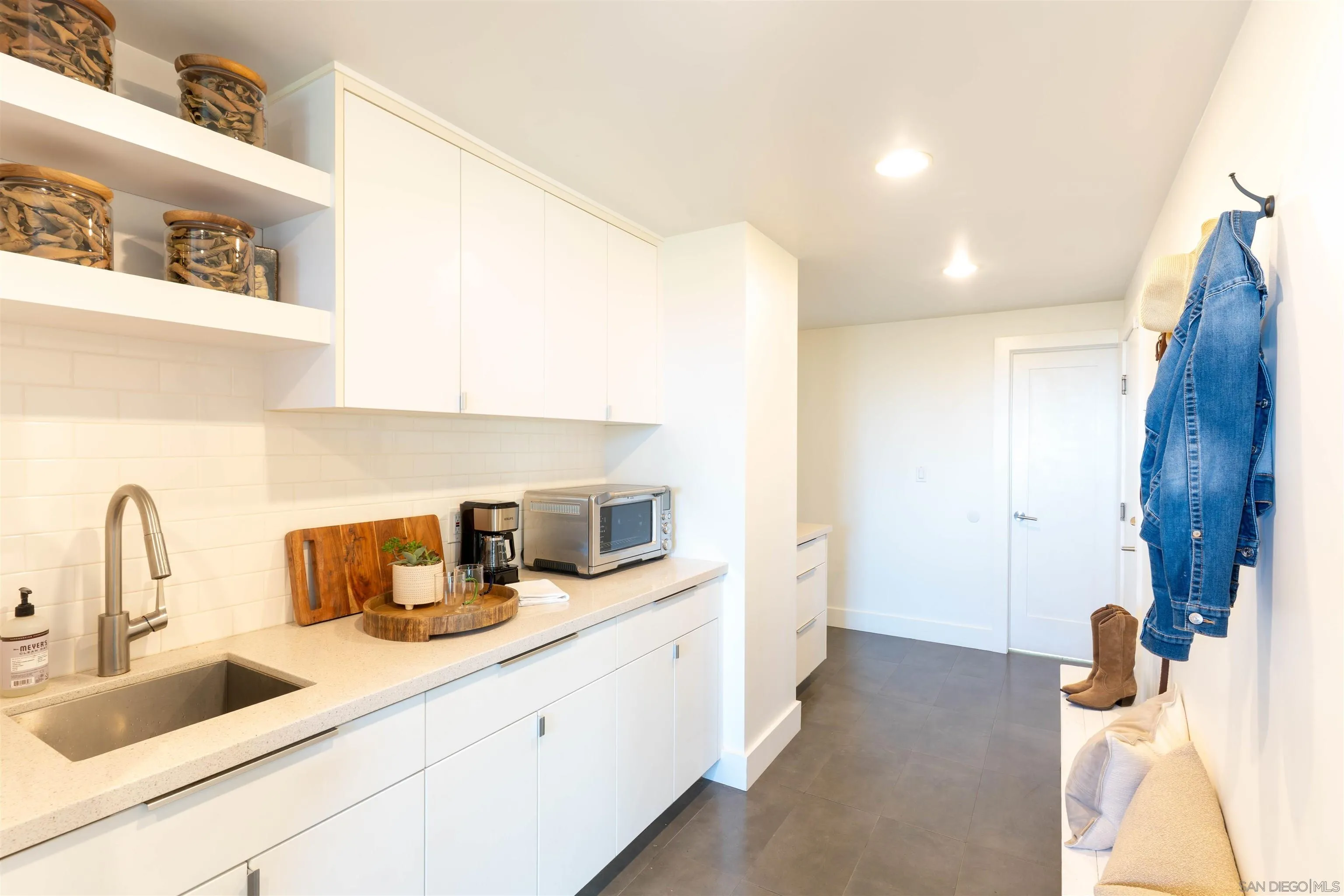 30410 Calle La Reina Bonsall, CA 92003 - Photo 33 of 54 a kitchen with a sink and a refrigerator