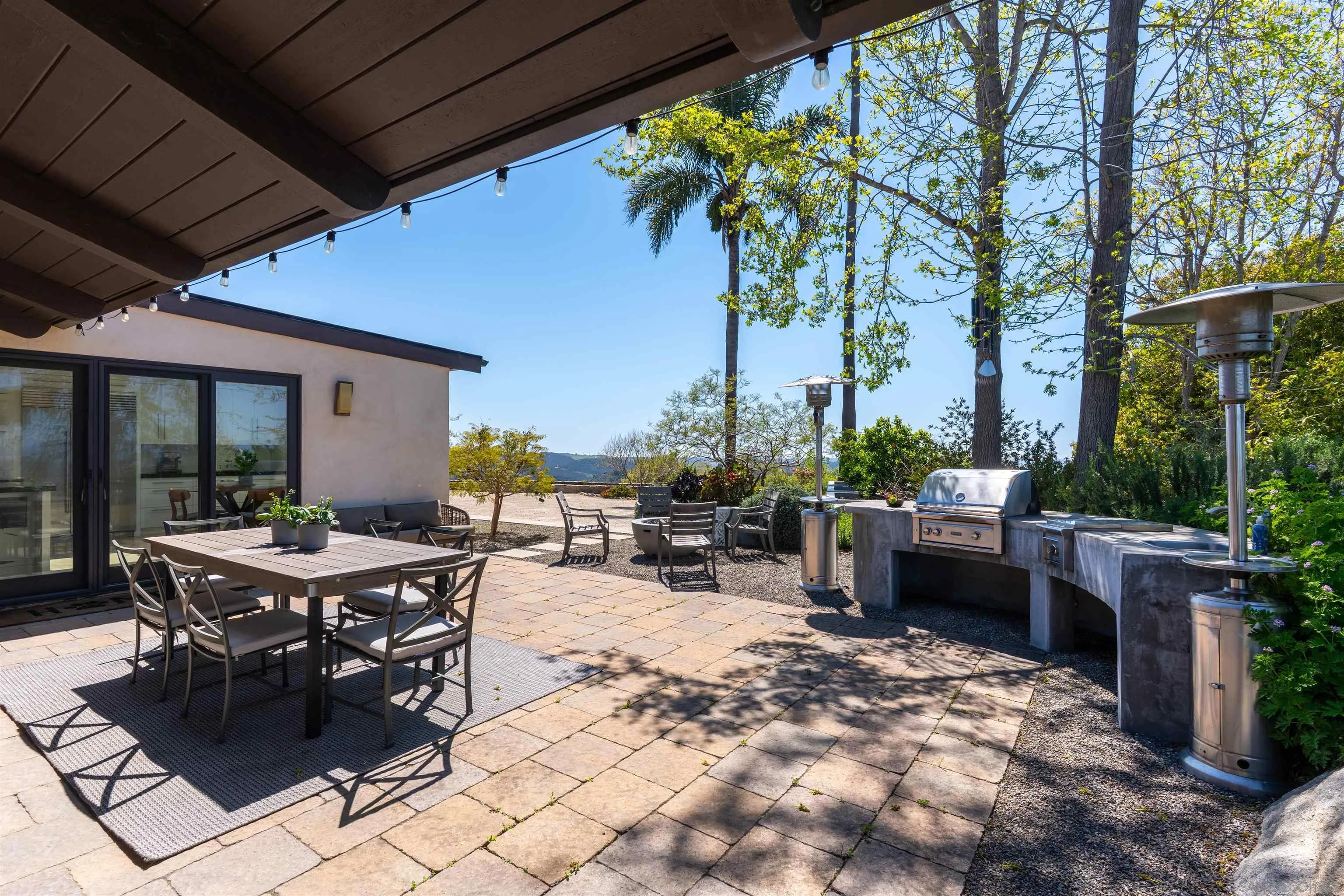 30410 Calle La Reina Bonsall, CA 92003 - Photo 43 of 54 a view of a backyard with sitting area