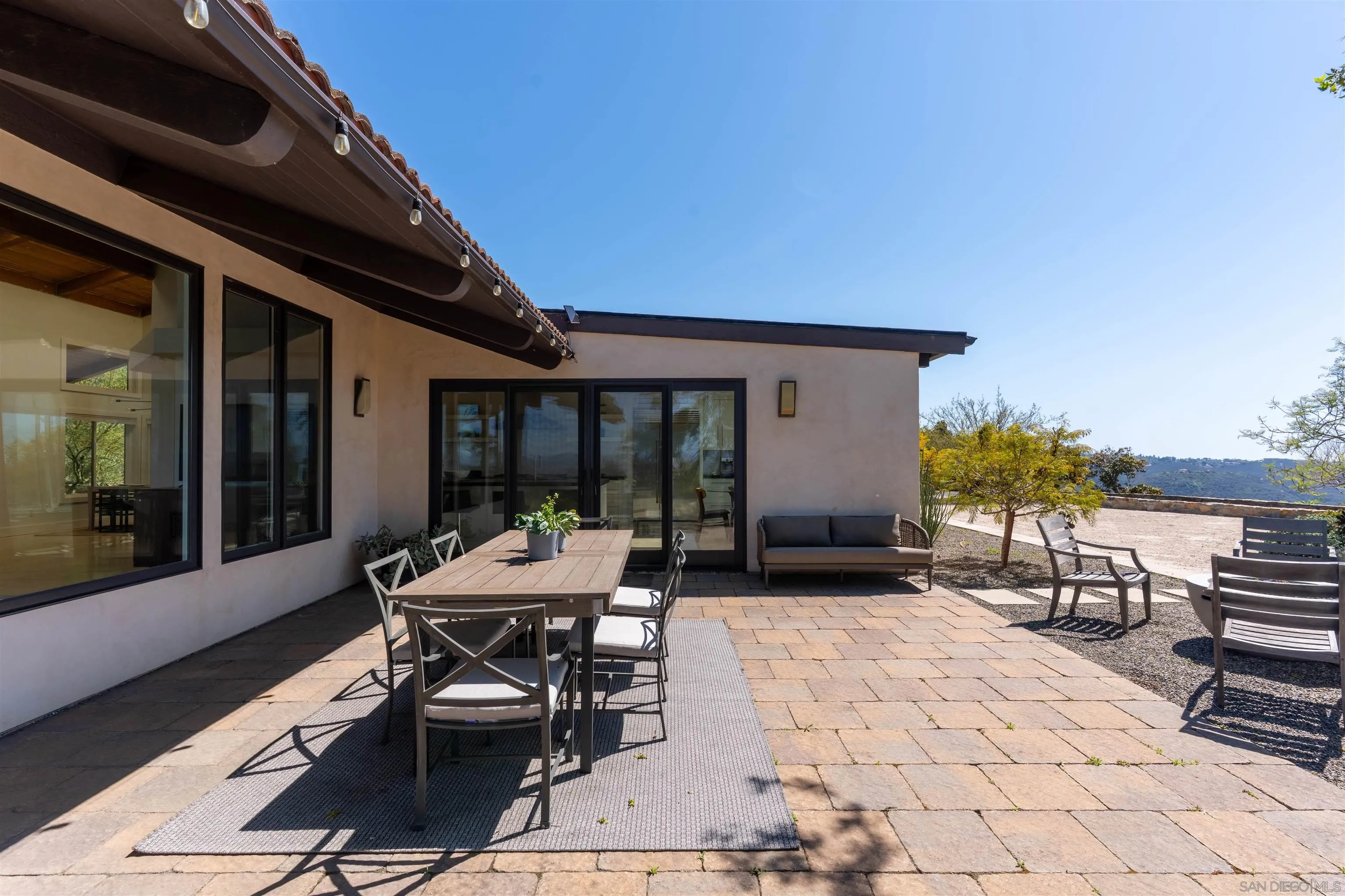30410 Calle La Reina Bonsall, CA 92003 - Photo 44 of 54 a patio with table and chairs