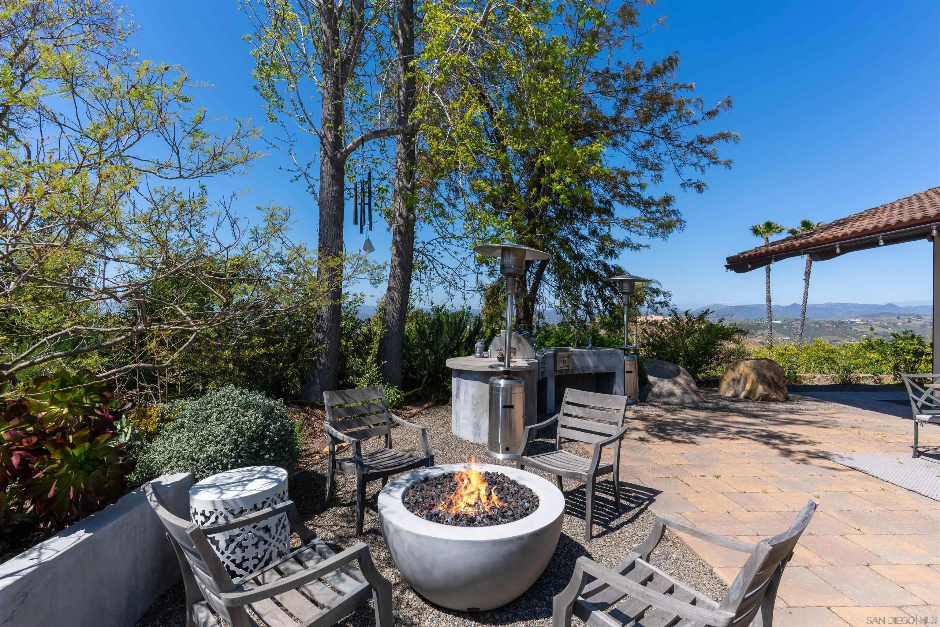 30410 Calle La Reina Bonsall, CA 92003 - Photo 46 of 54 a view of a chairs and table in backyard