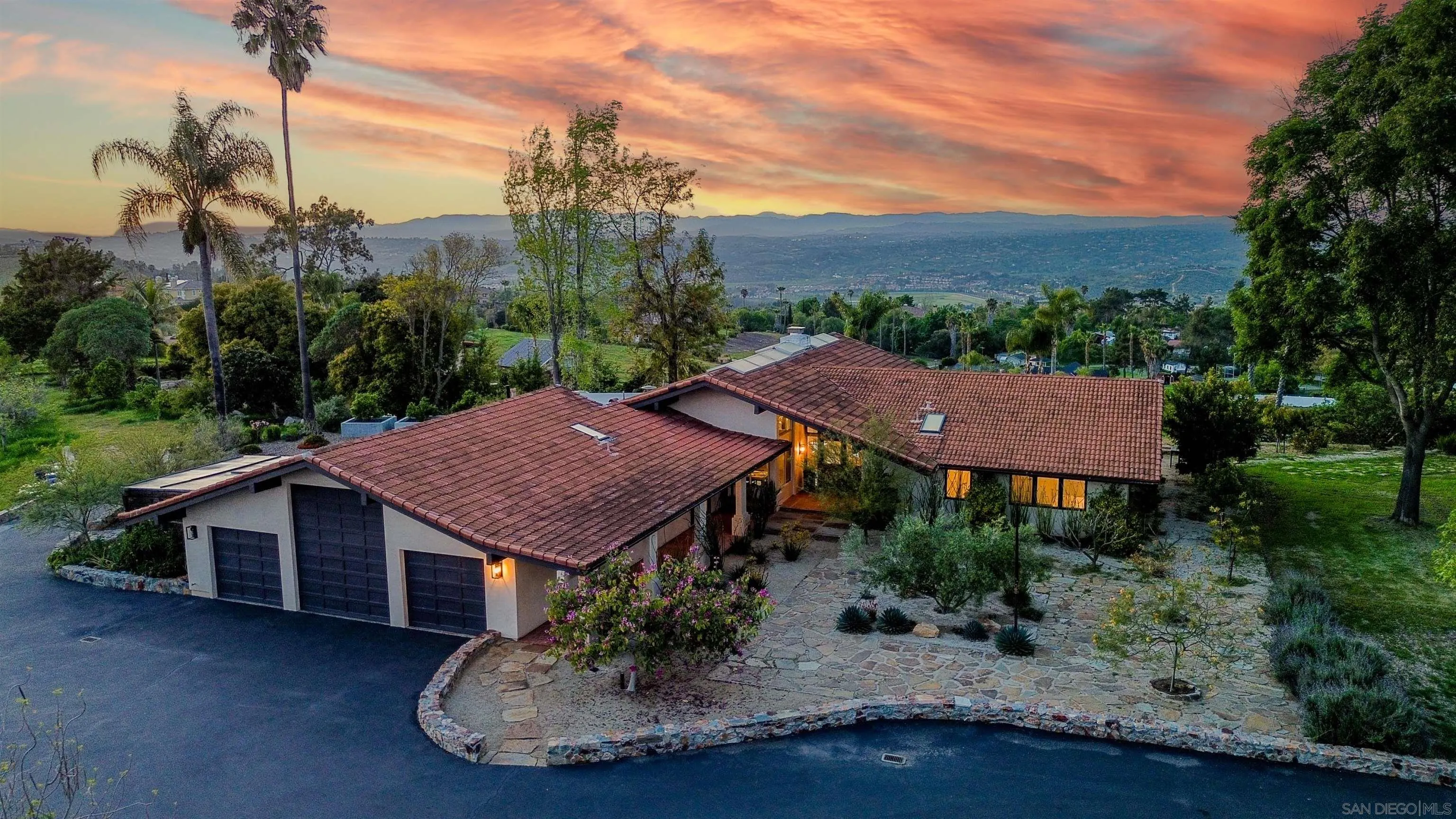 30410 Calle La Reina Bonsall, CA 92003 - Photo 48 of 54 a view of a house with a patio table and chairs