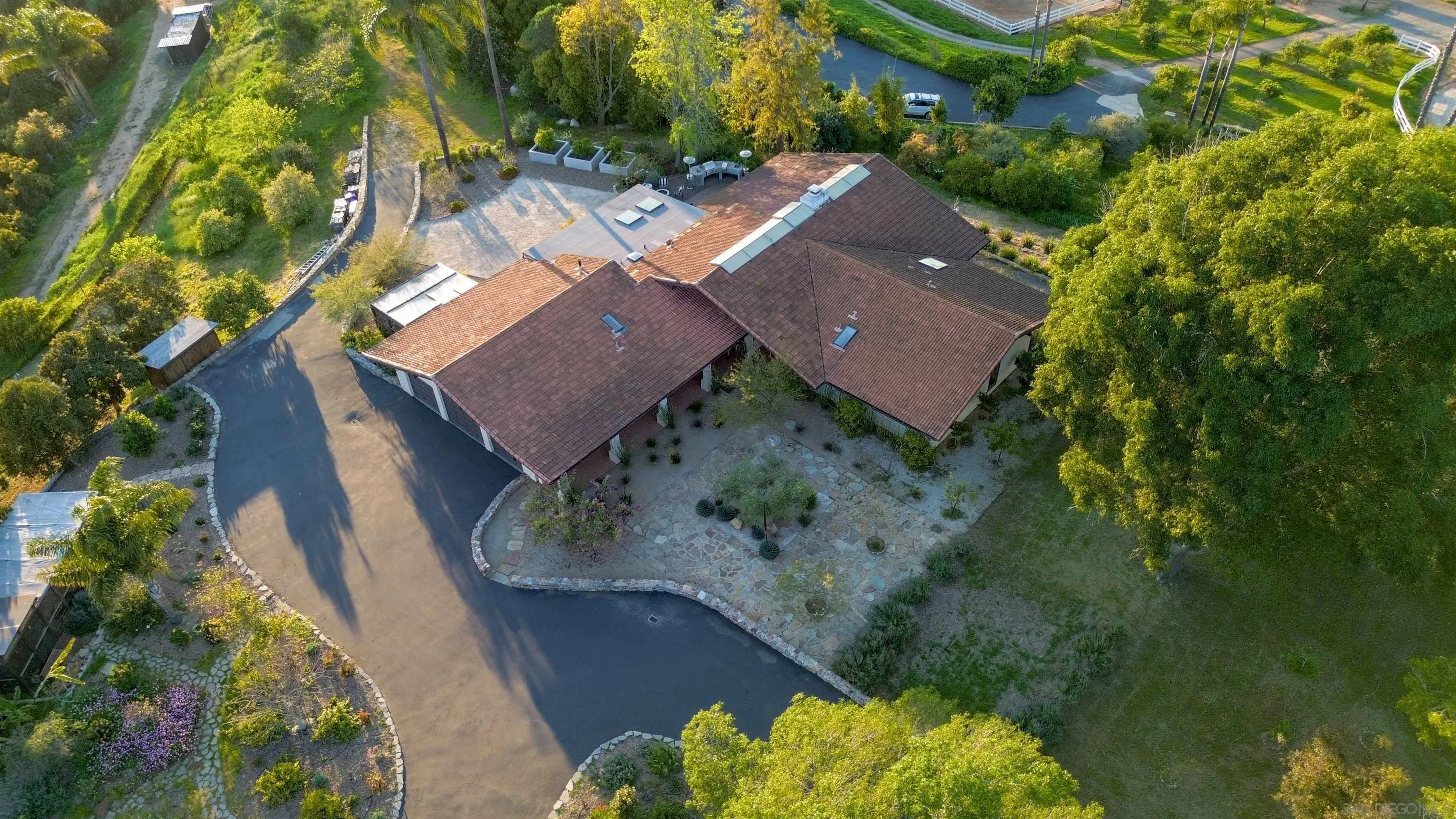 30410 Calle La Reina Bonsall, CA 92003 - Photo 50 of 54 an aerial view of a house with a yard
