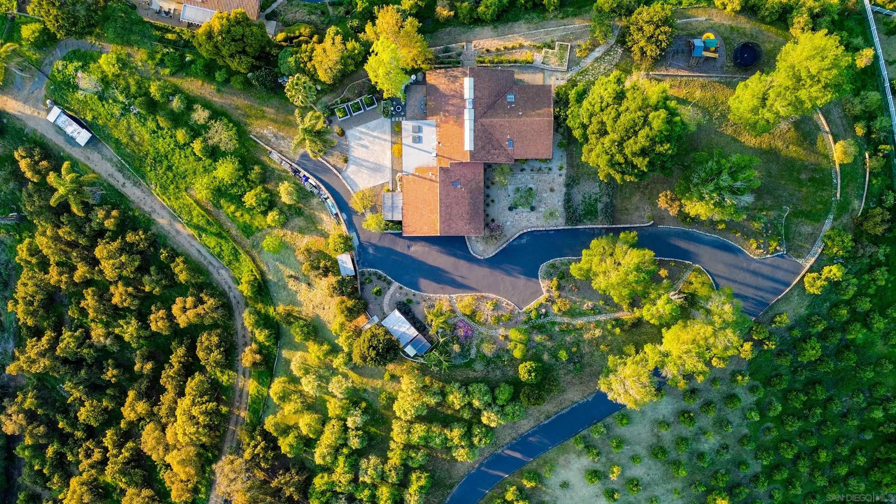 30410 Calle La Reina Bonsall, CA 92003 - Photo 5 of 54 an aerial view of a house with a yard swimming pool outdoor seating and yard