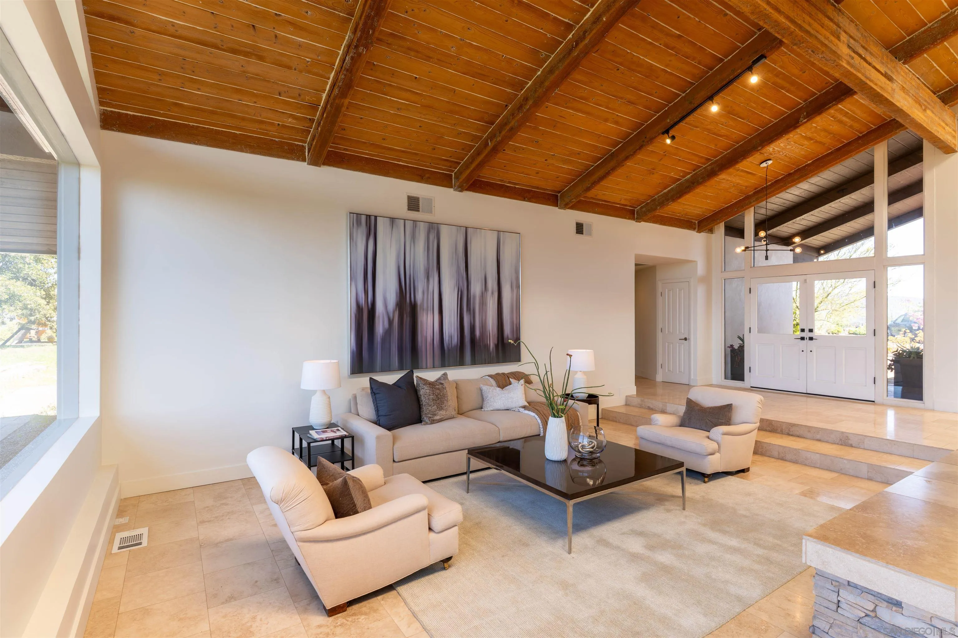 30410 Calle La Reina Bonsall, CA 92003 - Photo 10 of 54 a living room with furniture and a large window