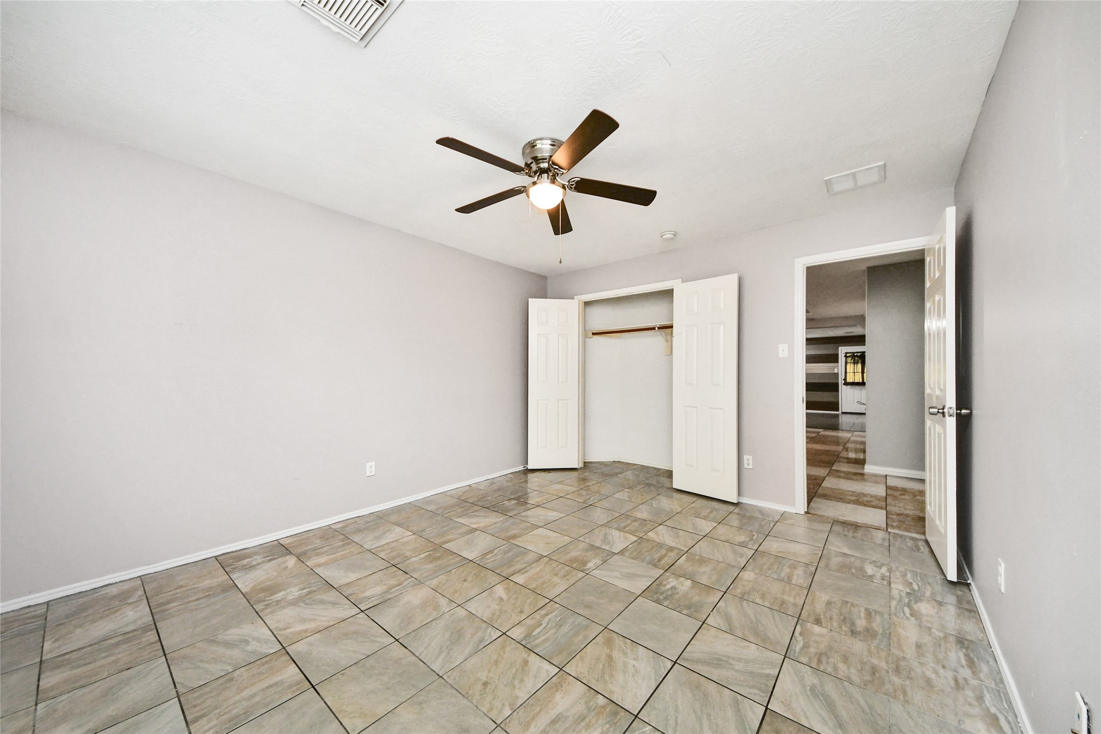 24019 Kingbriar Drive Spring, TX 77373 - Photo 35 of 41 This perspective shows the full entry closet with double doors, ensuring plenty of storage space for loved ones or guests.