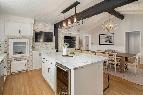 a view of kitchen with cabinets and wooden floor