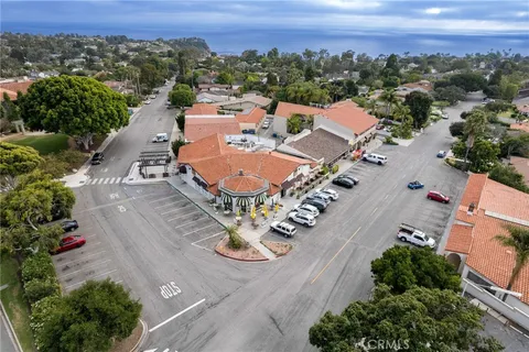 an aerial view of a house with a garden