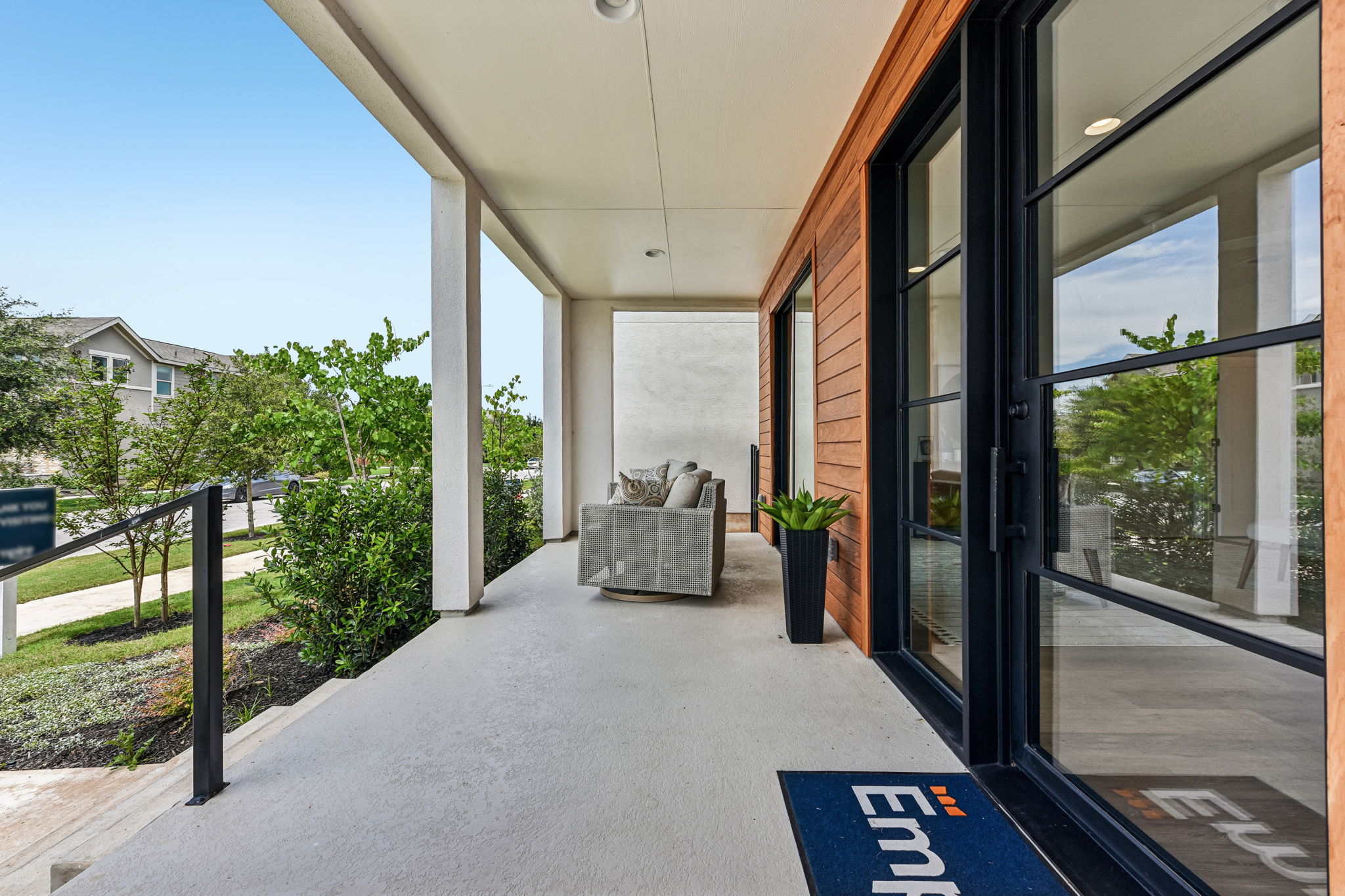 9101 Cattle Baron Path Austin, TX 78747 - Photo 38 of 40 A spacious covered patio invites relaxation with modern design elements and verdant landscaping.