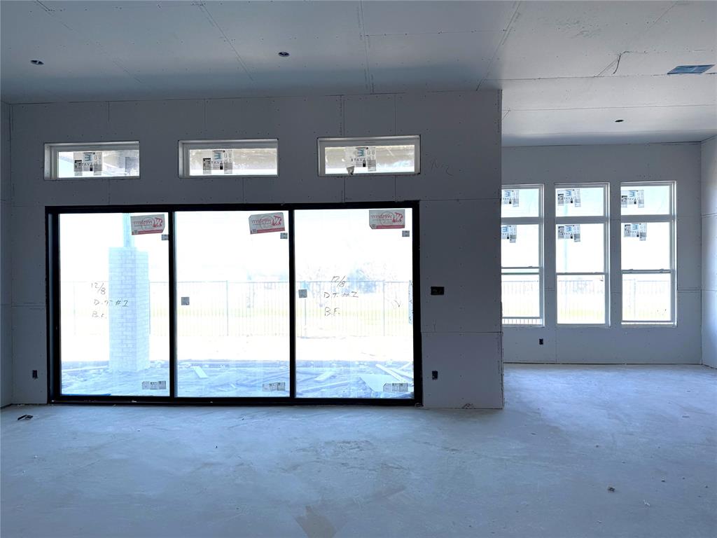 9821 Palermo Lane Forney, TX 75126 - Photo 3 of 7 an empty room with large windows