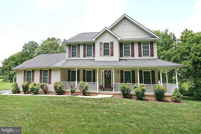 4830 Roop Road Mount Airy, MD 21771 - Photo 1 of 30 a front view of a house with a yard and potted plants