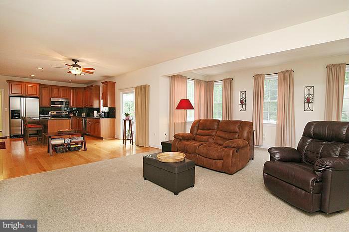 4830 Roop Road Mount Airy, MD 21771 - Photo 11 of 30 a living room with furniture and kitchen view