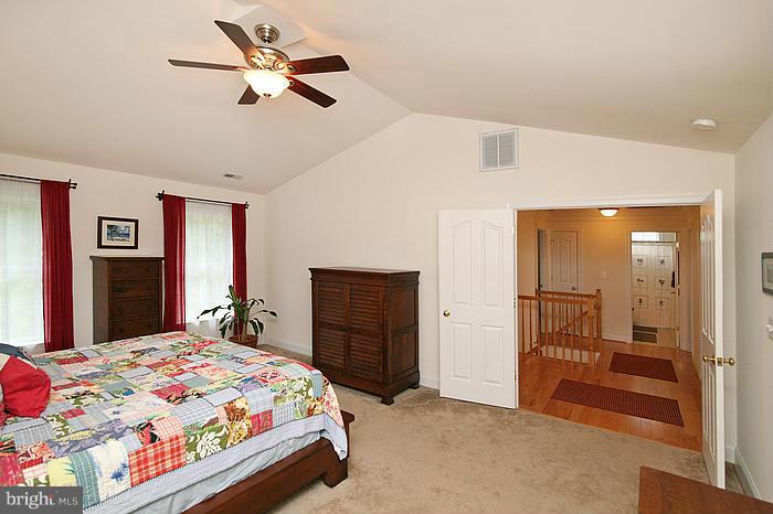 4830 Roop Road Mount Airy, MD 21771 - Photo 19 of 30 a bedroom with a bed and a dresser