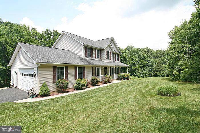 4830 Roop Road Mount Airy, MD 21771 - Photo 24 of 30 a front view of a house with a garden